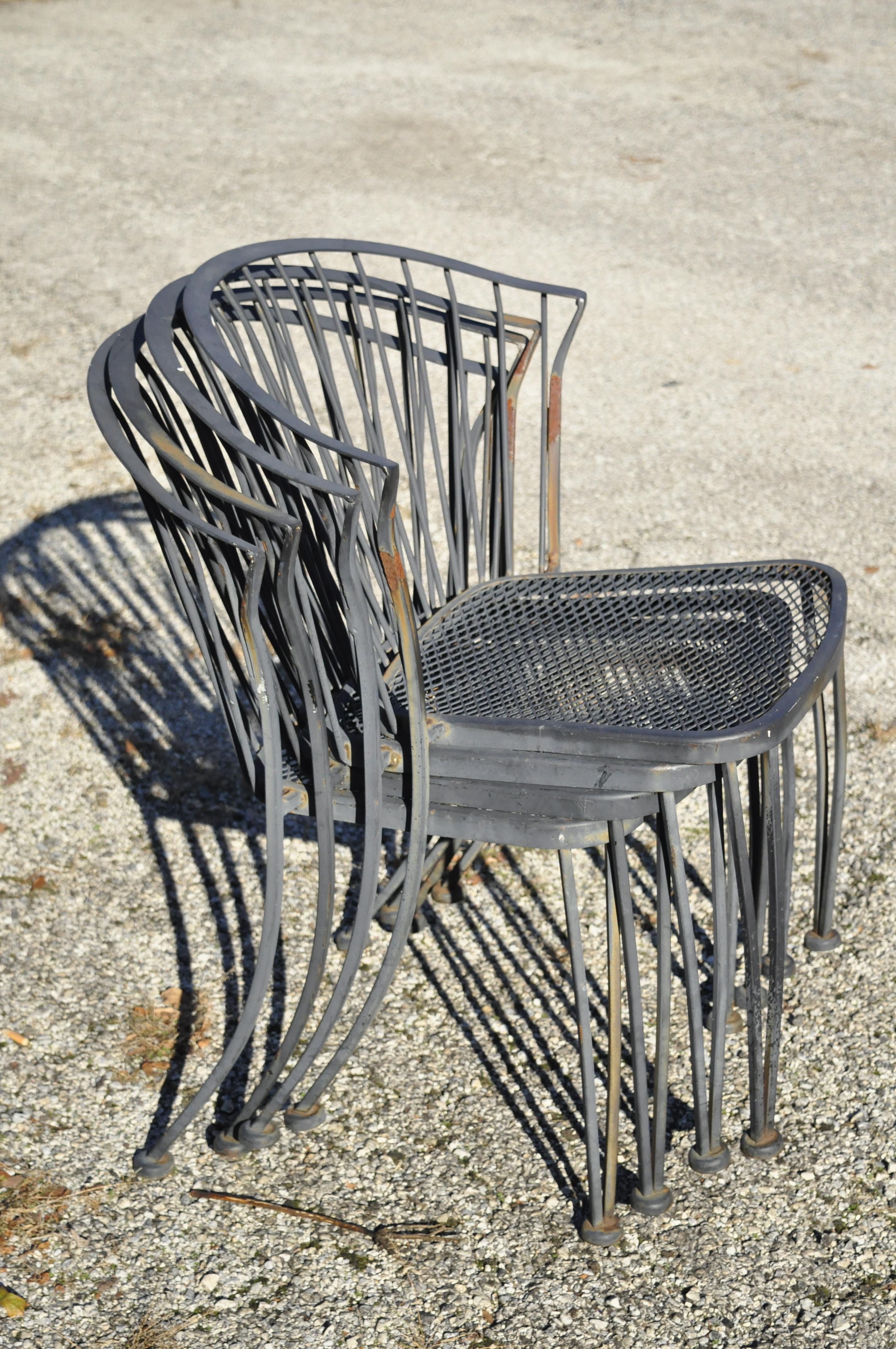 Vintage Carolina Forge wrought iron barrel back midcentury Patio chairs - Set of 4. Item features stacking frames, wrought iron construction, original tag, very nice vintage set, great style and form, circa mid-late 20th century. Measurements: 31.5