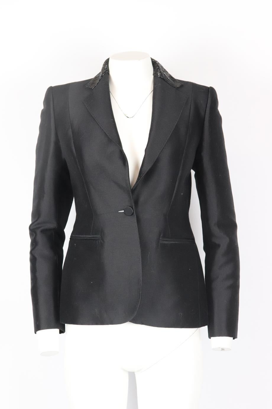 Carolina Herrera bead embellished cotton and silk blend blazer. Black. Long sleeve, v-neck. Button fastening at front. 90% Cotton, 10% silk; lining: 100% silk. Size: US 4 (UK 8, FR 36, IT 40). Shoulder to shoulder: 15.5 in. Bust: 33.6 in. Waist: