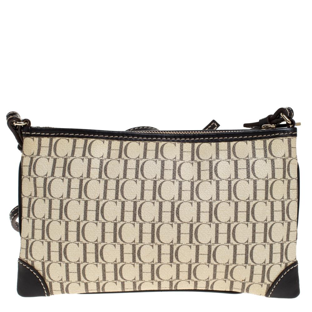 Channel your fondness for simple styles with this monogram canvas and leather bag. With an expertly-lined fabric interior, this bag can accommodate all your essentials. Carry this crossbody bag by Carolina Herrera wherever you go and enjoy fashion