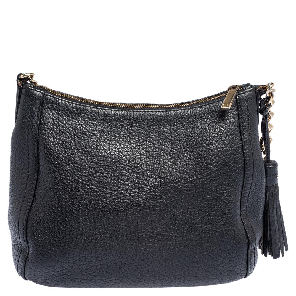 Coming from the house of Carolina Herrera, this trendy shoulder bag ensures comfort and style. This black chain tassel bag is sophisticated, stylish, and designed in a plush leather body. The fabric-lined interior of this bag can hold all your