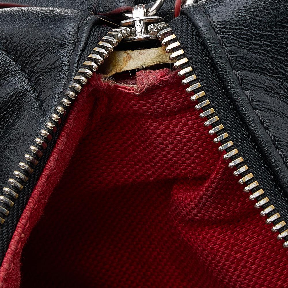 Experience fine craftsmanship with this bag from Carolina Herrera. It is crafted from quilted leather and flaunts a CH-adorned front and a zip-enclosed lined interior. This elegant bag is held by a shoulder strap.

Includes: Original Dustbag