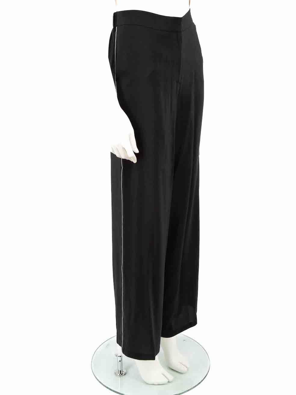 CONDITION is Very good. Minimal wear to trousers is evident. Minimal wear to the front fastening as this has been re-attached with a different colour thread on this used Carolina Herrera designer resale item.
 
 Details
 Black
 Silk
 Trousers
 Wide