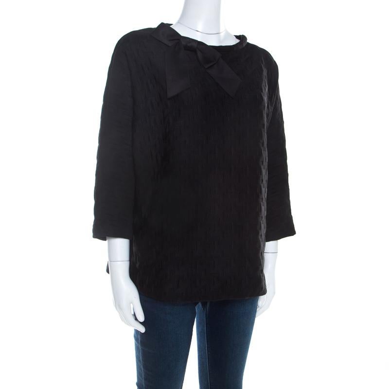 Carolina Herrera brings to you this unique and unconventional top, that is pretty and smart. Add a unique flair to your wardrobe with this smart black piece. Tailored from blended fabric, this long-sleeved top is just what you need to stand out in a