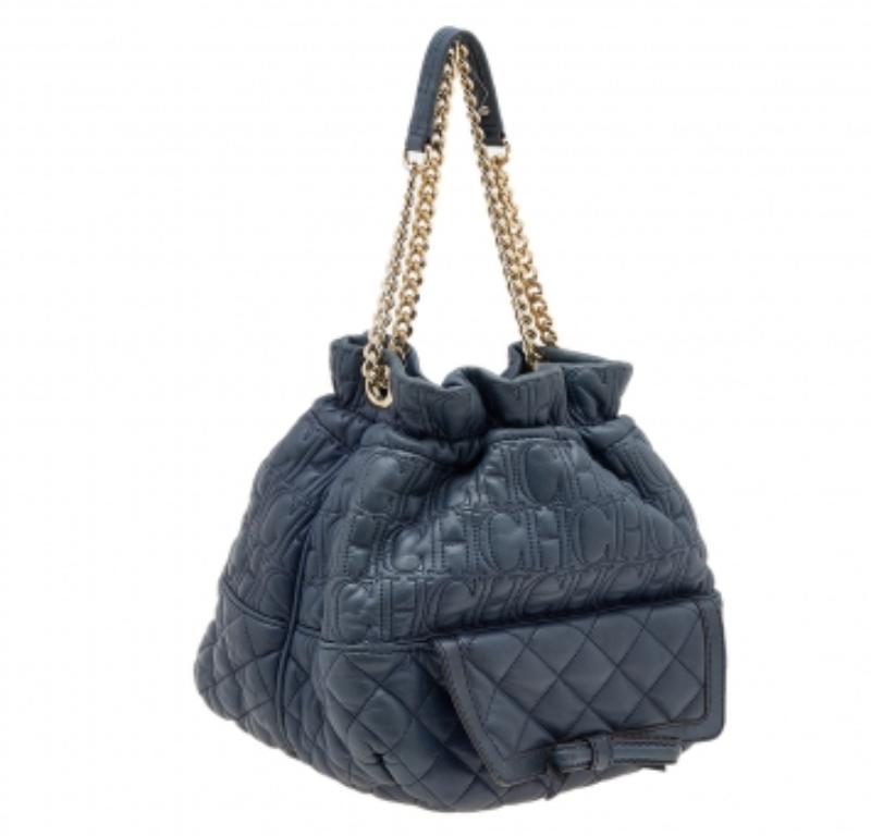 Join the bucket bag trend with this beauty from Carolina Herrera. Crafted using quilted leather, the blue bag has a relaxed structure, front flap compartment, fabric lining, and a sliding chain handle.