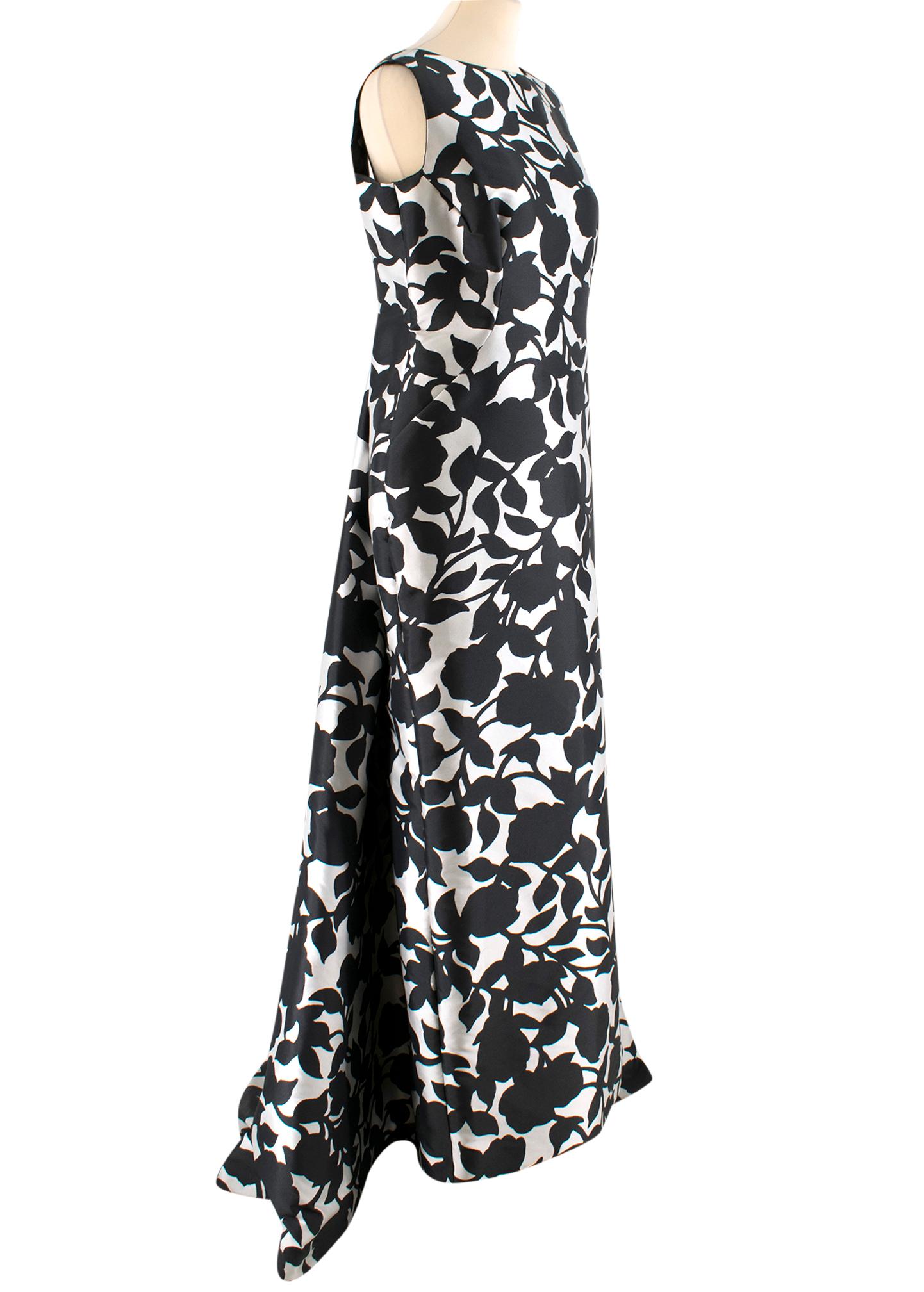 Carolina Herrera Boutique White & Black Floral Gown

- gown black and white dress
- floral pattern 
- open back 
- boat neckline
- hidden zip fastening to the side
- asymmetric length - longer to the back 

Please note, these items are pre-owned and