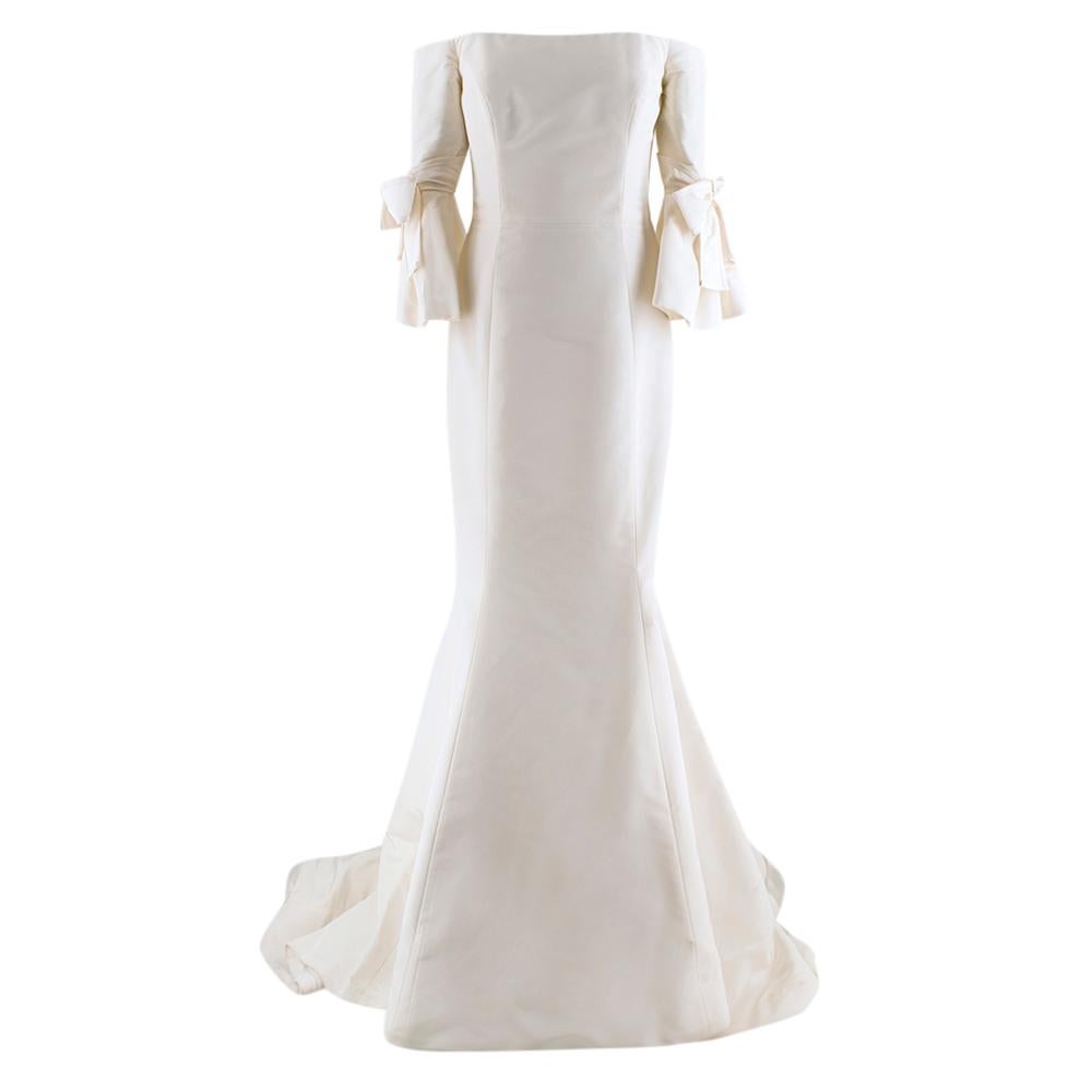 Carolina Herrera Bridal Spring collection 2018 Faye Dress. Features bow sleeves, and a close-fitting silhouette and flared hem. RRP £5,500

- Concealed zip and hook fastening
- Comes with original clothing bag

Please note, these items are pre-owned