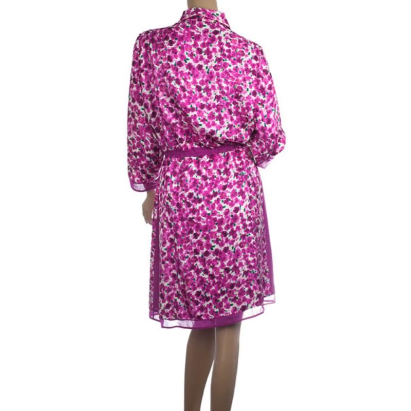 From the Summer 2012 RTW collection by Carolina Herrera, this floral silk print shirt dress is perfect for this season. It features a spread collar, an elasticized drawstring waistband, three quarter long sleeves, front placket, contrasting sheer