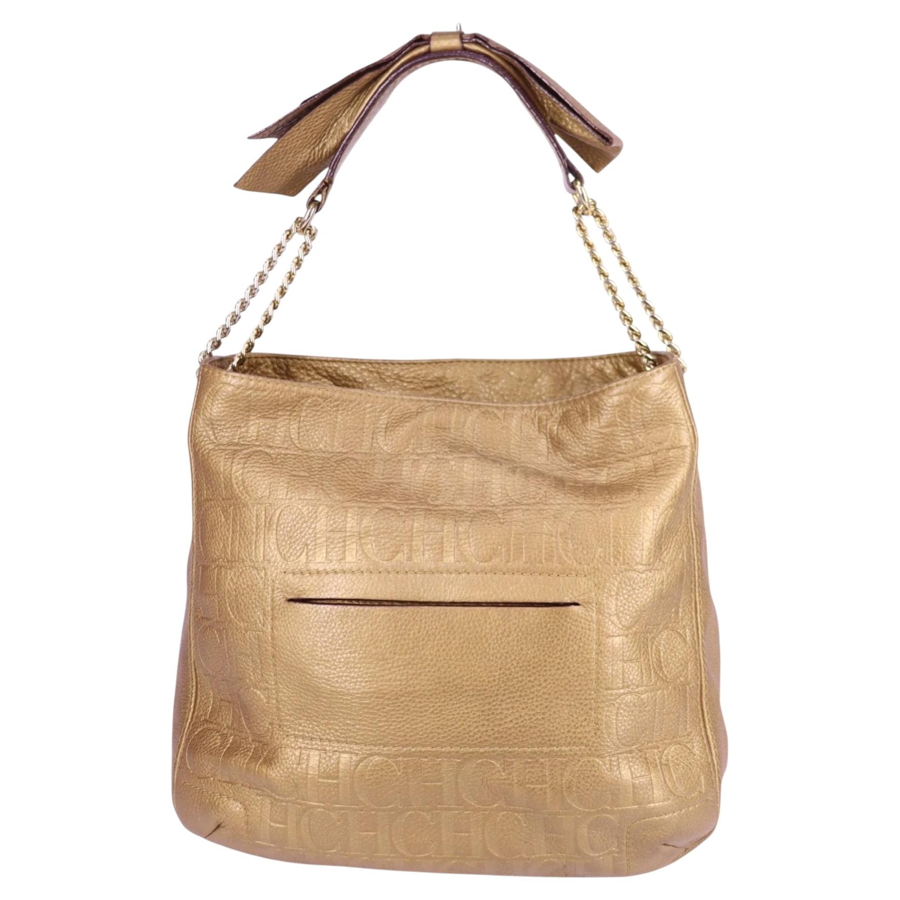 Bolso de hombro con lazo y monograma dorado Carolina Herrera