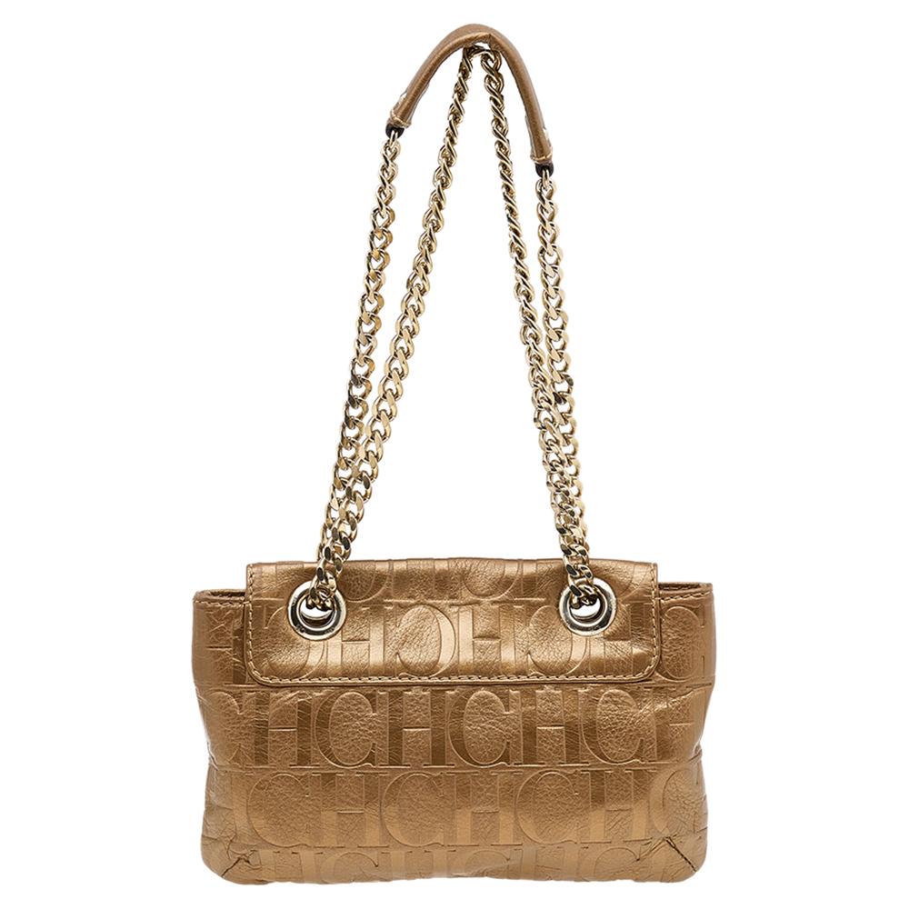 The Audrey bag from Carolina Herrera remains a loved creation from the label. This bag is created using monogram embossed leather on the exterior with an enlarged bow motif and gold-toned implements adorning its shape. It is held by a sturdy sliding