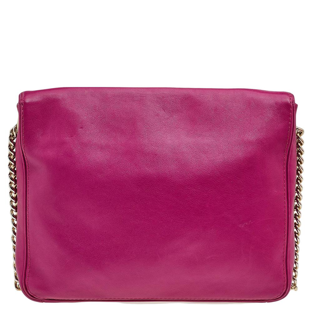 This Baltazar flap bag from Carolina Herrera exemplifies the brand's signature aesthetics in a practical way. Expertly crafted using leather and accentuated with the CHHC logo, this fabulous bag has a flap secured with a magnetic snap closure to