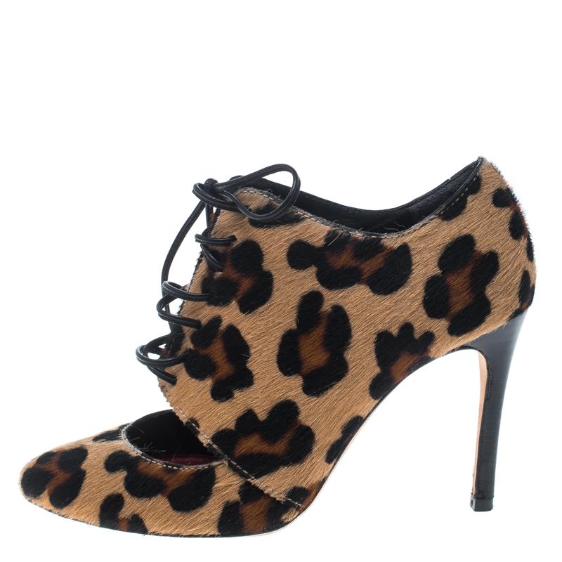 Crafted exquisitely from leopard-printed calf hair, these Carolina Herrera booties were built to lift your outfits and your spirits. Strings are laced perfectly at the front, cutouts are detailed on the vamps, while beautifully sculpted 9 cm heels