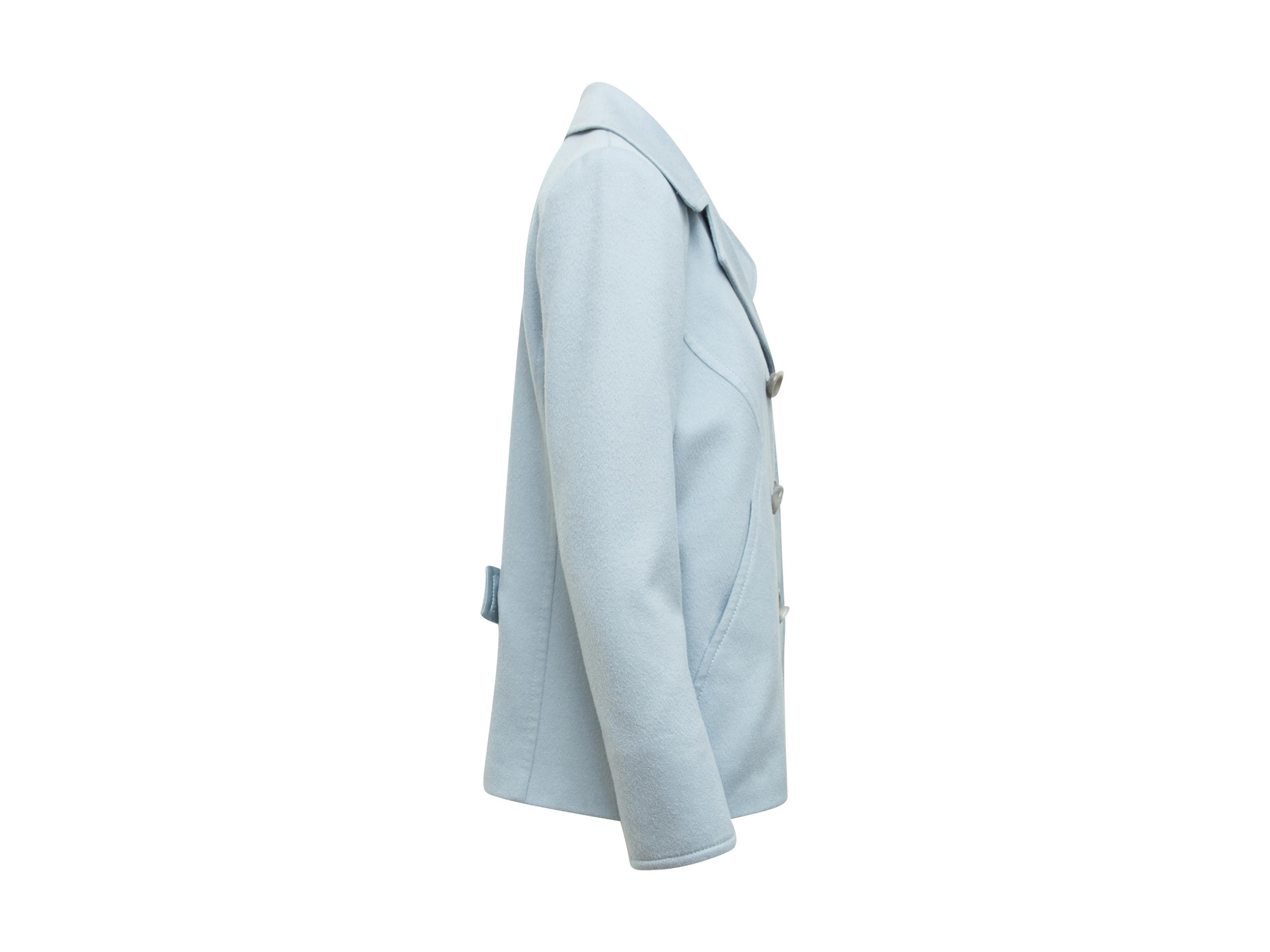 Product details:  Light blue wool/silk-blend peacoat by Carolina Herrera.  Notched lapel.  Long sleeves.  Double-breasted button-front closure.  36