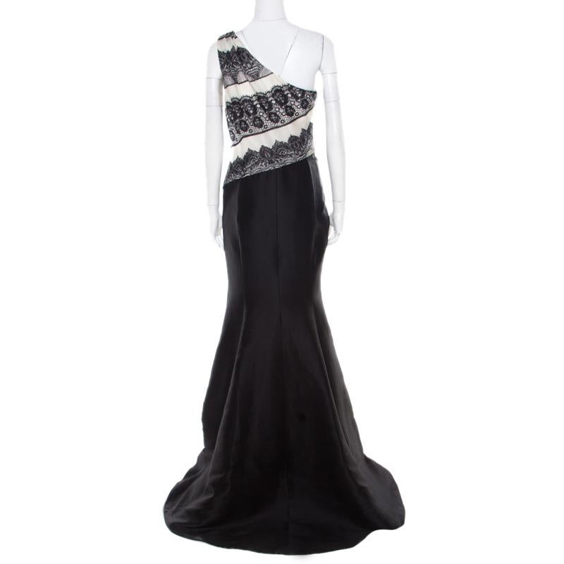 This one shoulder evening gown from Carolina Herrera is sure to make you the centre of attraction and grab you never ending compliments! The monochrome creation is made of 100% silk and features a flattering feminine silhouette. It flaunts a lace