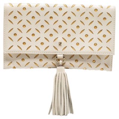 Carolina Herrera Off White/Gold Laser Cut Leather Tassel Clutch