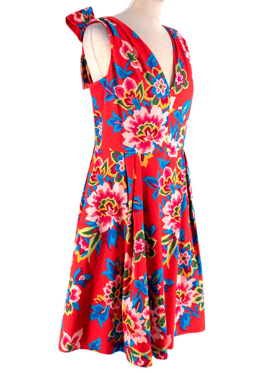 Carolina Herrera Red Floral Cotton Summer Dress
 

 - Chili-red cotton sun dress, featuring a v-neck, sleeveless silhouette, with a nipped in waist, and full, knee length skirt
 - All-over colourful floral reminscent of tapestry designs, with