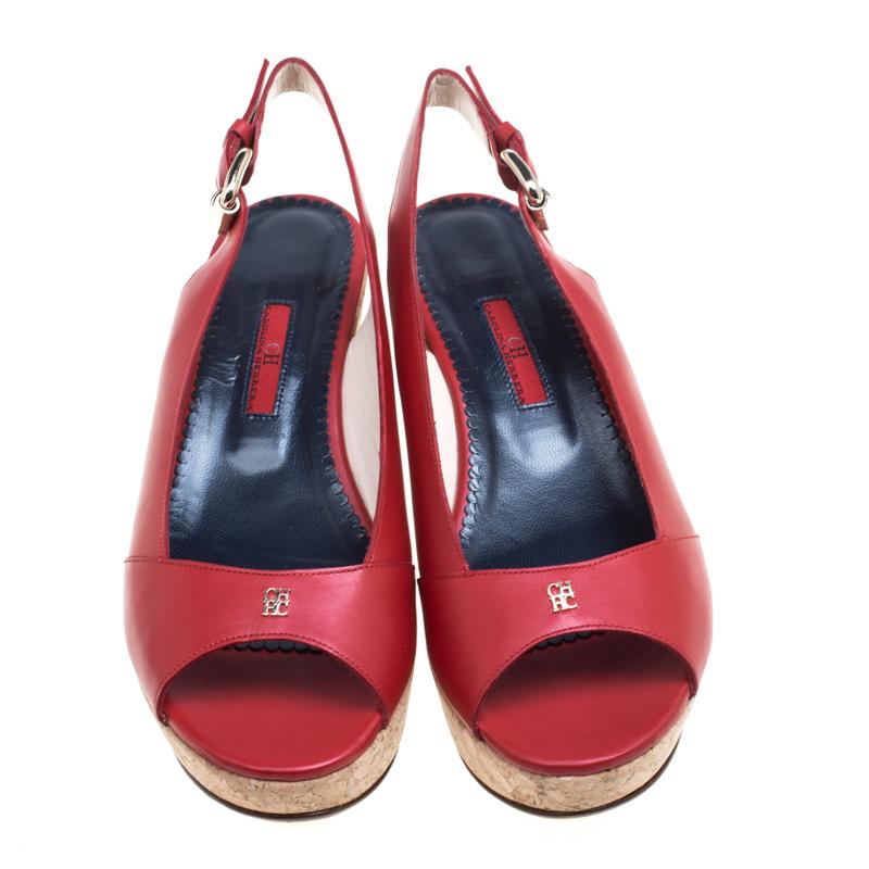 Made of red leather, these sandals add all the glam that a splendid outfit needs for the evening. With petite, gold-tone logo details on the vamp and open toes, these chic sandals come with leather insoles and slingback straps. These come with cork