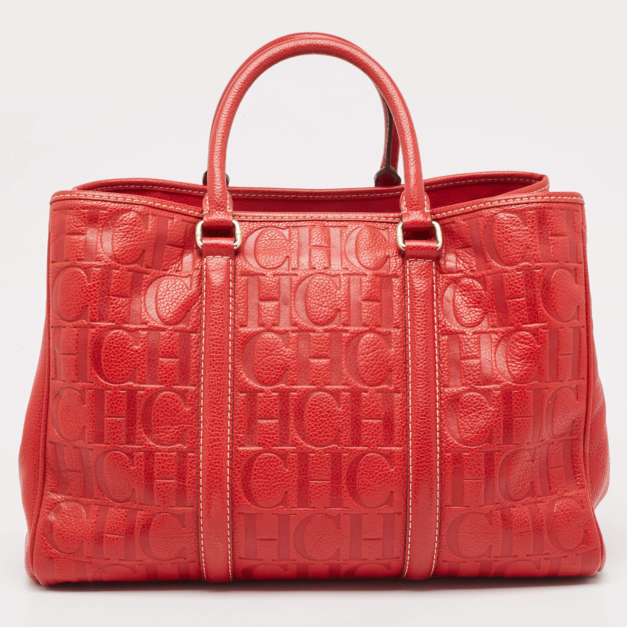 This Matteo tote from Carolina Herrera is an all-time favorite. It is made from monogram embossed leather and comes in a lovely red shade.

