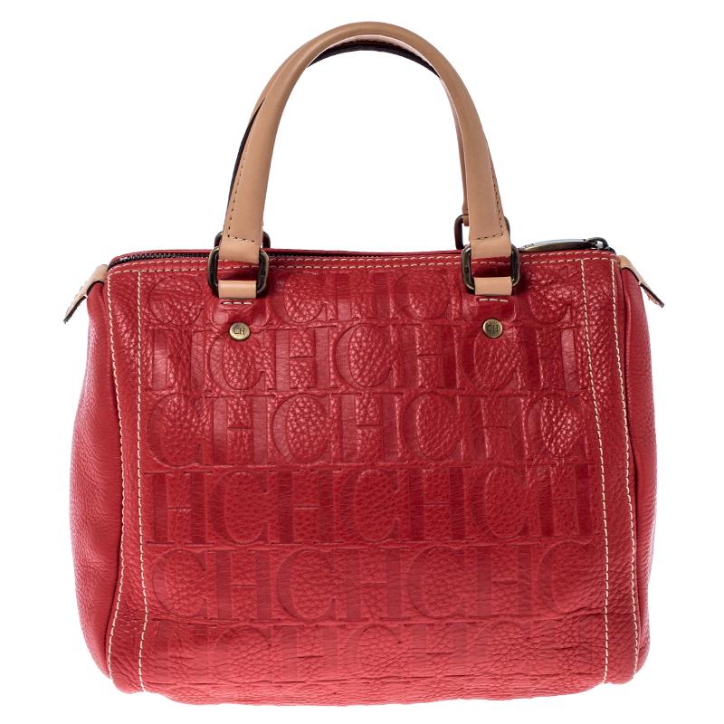 A truly elegant piece to add to your collection, this Andy Boston Bag by Carolina Herrera comes crafted from red leather and styled with neat stitch detailing. It features a top zip closure, two handles, protective metal feet, and a spacious