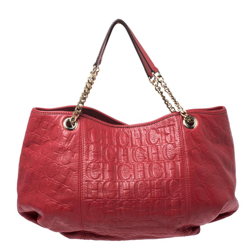 This hobo by Carolina Herrera is stylish and functional. Crafted from the brand's signature red Monogram leather, it features a lovely silhouette. It comes with dual chain handles and a nylon interior with enough space to house your essentials. This