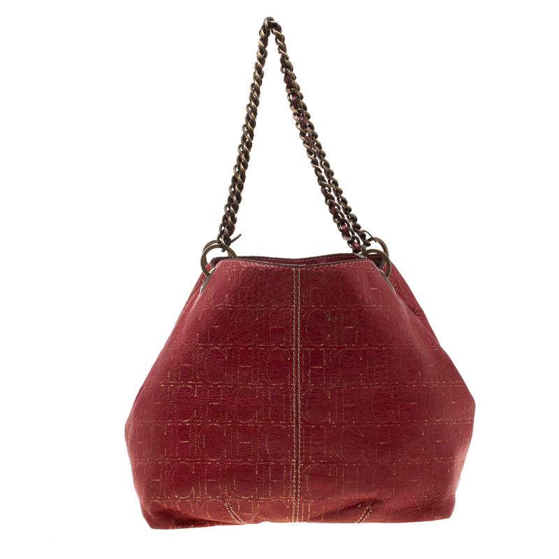 This red shoulder bag by Carolina Herrera is lifted by signature details like the monogrammed leather body and gold-tone chain and leather entwined straps. The large interior is lined in fabric and has a pocket for organising all your daily