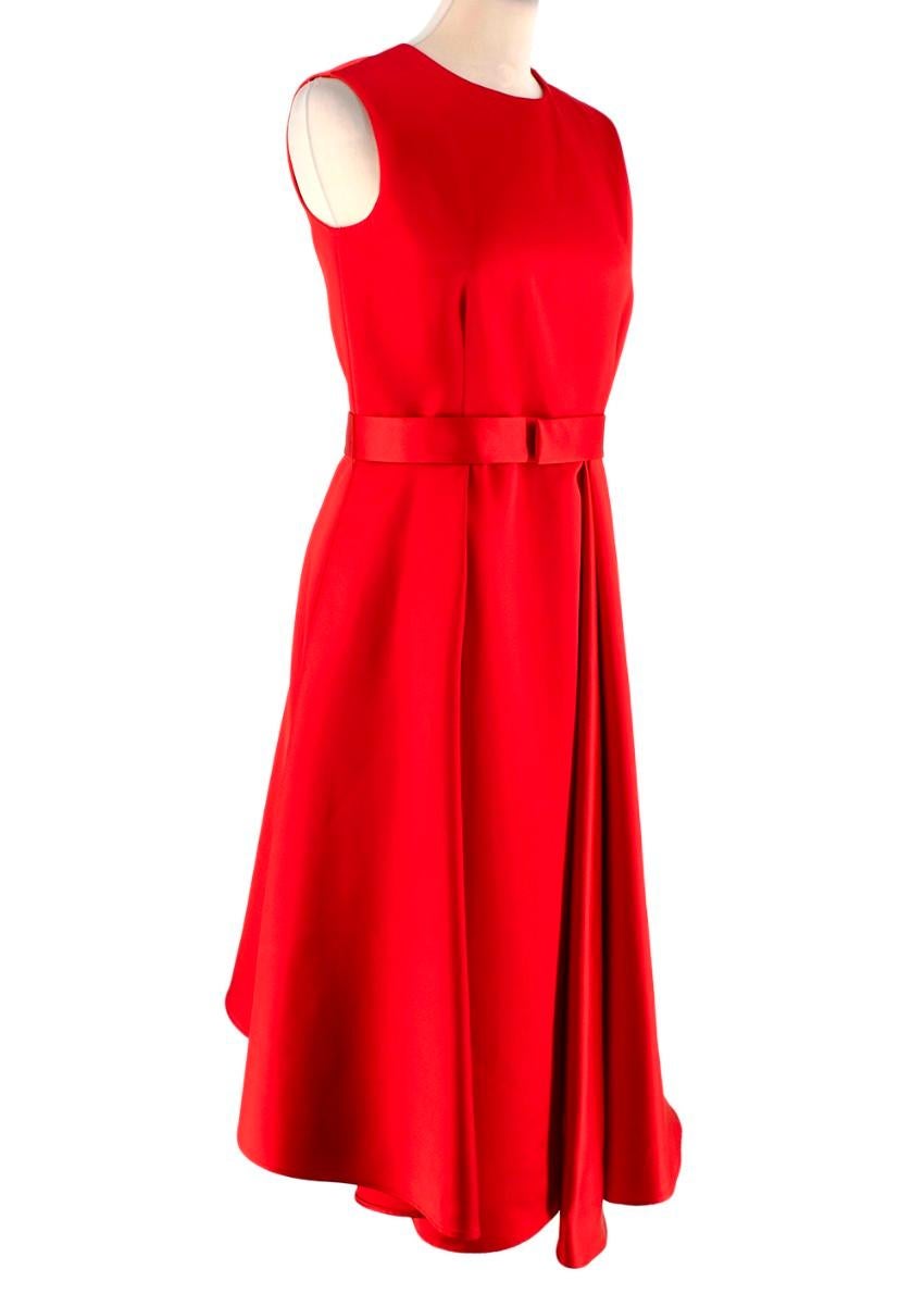 Carolina Herrera Red Satin Pleated Midi Dress

- Deep red satin midi dress with tonal belt
- Pleated detail to the skirt
- Concealed side zip closures
- Two side pockets
- Fully lined

Materials:
100% Polyester

Made in Portugal
Dry clean