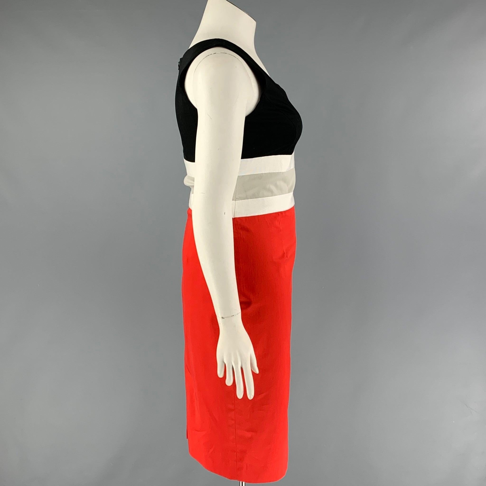 CAROLINA HERRERA dress comes in a red & black color block cotton featuring a sheath style, sleeveless, grosgrain trim, and a back zip up closure.
Very Good
Pre-Owned Condition. 

Marked:   10 

Measurements: 
 
Shoulder: 12.5 inches  Bust: 34 inches