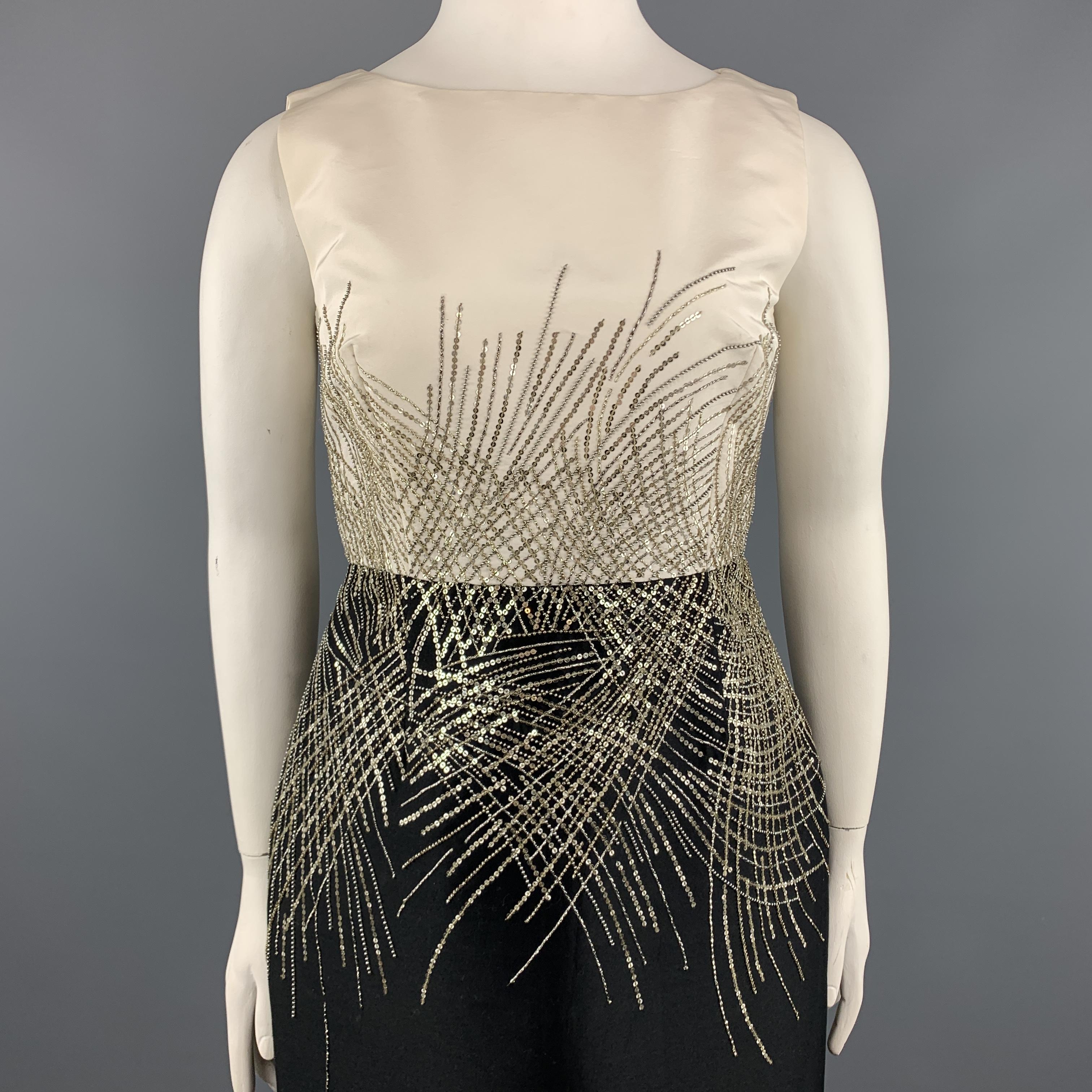 CAROLINA HERRERA sleeveless cocktail dress comes in silk taffeta with a cream boat neck shell top, black pencil skirt bottom, and metallic sequin beadwork pattern through the mid section. Made in USA.

Excellent Pre-Owned Condition.
Marked: