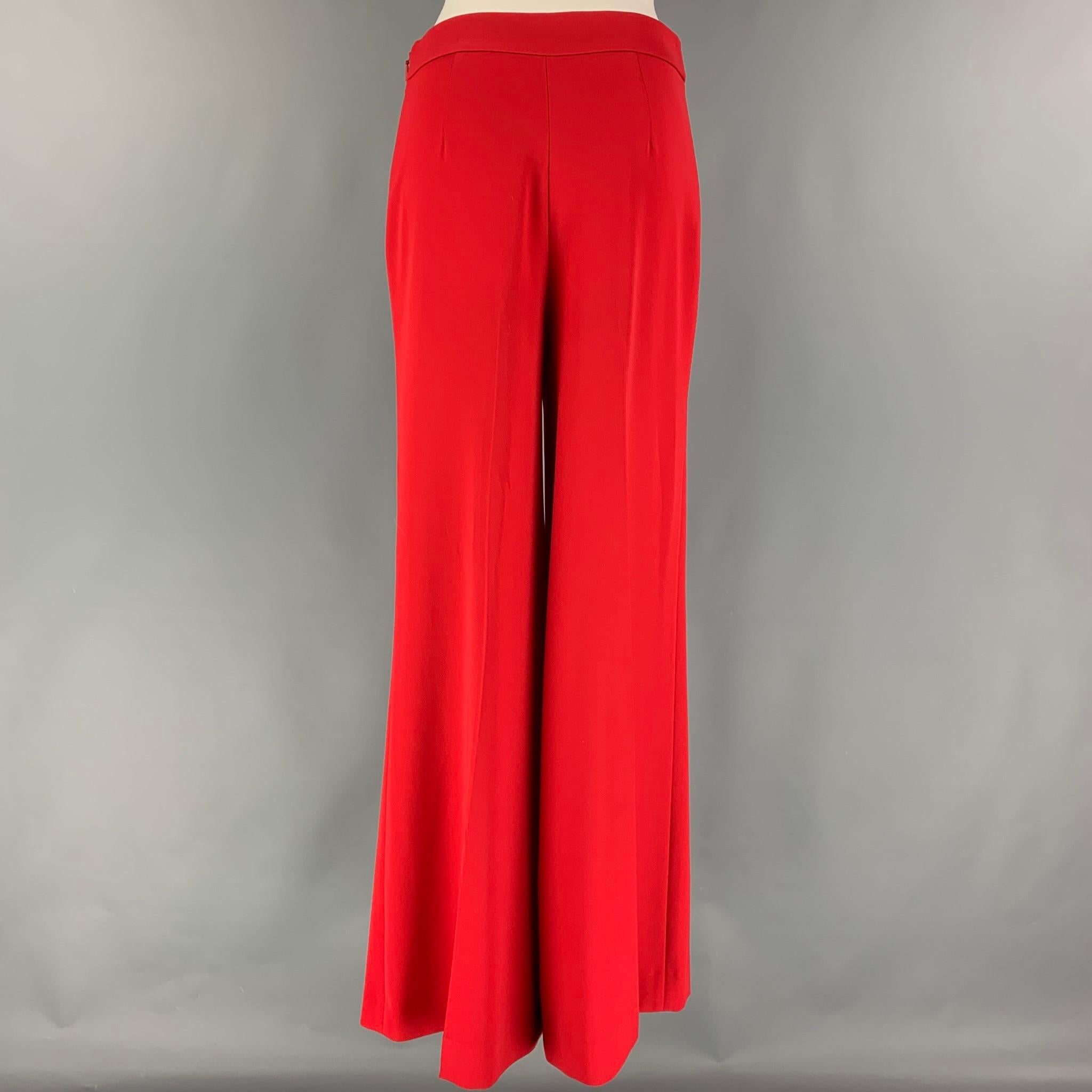 CAROLINA HERRERA pants comes in a red polyester featuring a wide leg style, high waist, and a side zipper closure. 

Very Good Pre-Owned Condition.
Marked: 4

Measurements:

Waist: 29 in.
Rise: 13.5 in.
Inseam: 33 in. 