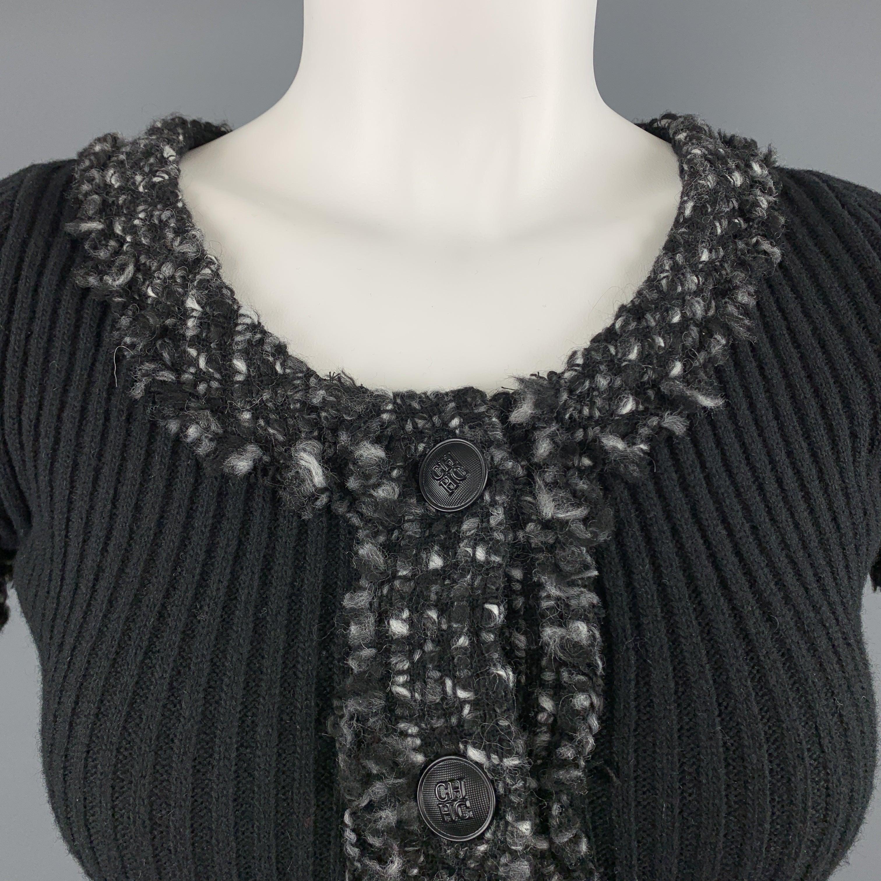 CAROLINA HERRERA pullover sweater comes in black ribbed knit with a round neckline, half button front, and gray tweed knit trim. Made in Spainches 
Excellent
Pre-Owned Condition. 

Marked:   XS 

Measurements: 
 
Shoulder:
12 inches Bust:
32 inches