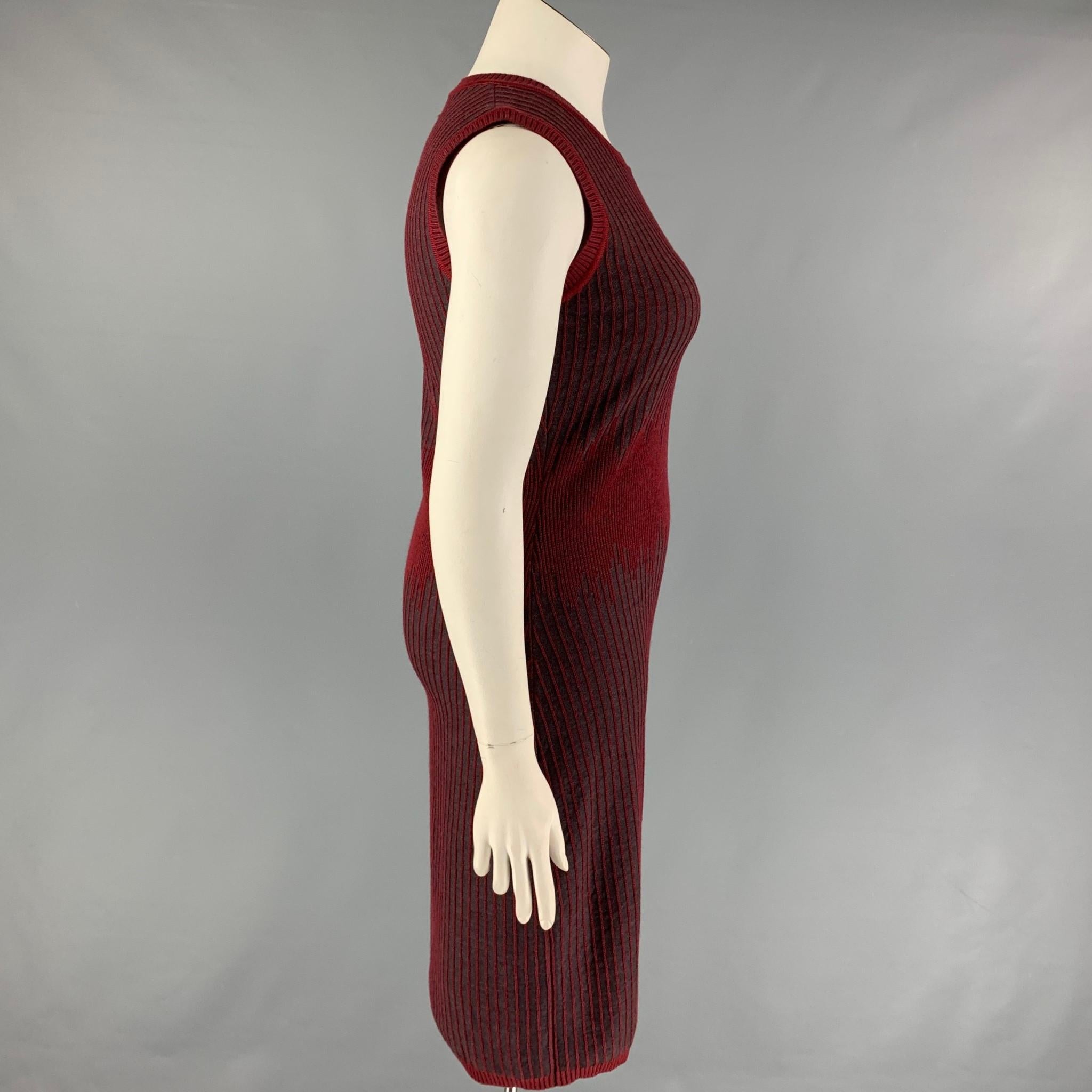 CAROLINA HERRERA dress comes in a burgundy & grey knitted stripe wool  featuring a sheath style, sleeveless, and a ribbed hem. Made in Italy. 

New With Tags. 
Marked: L
Original Retail Price: $1,390.00

Measurements:

Shoulder: 15 in.
Bust: 35