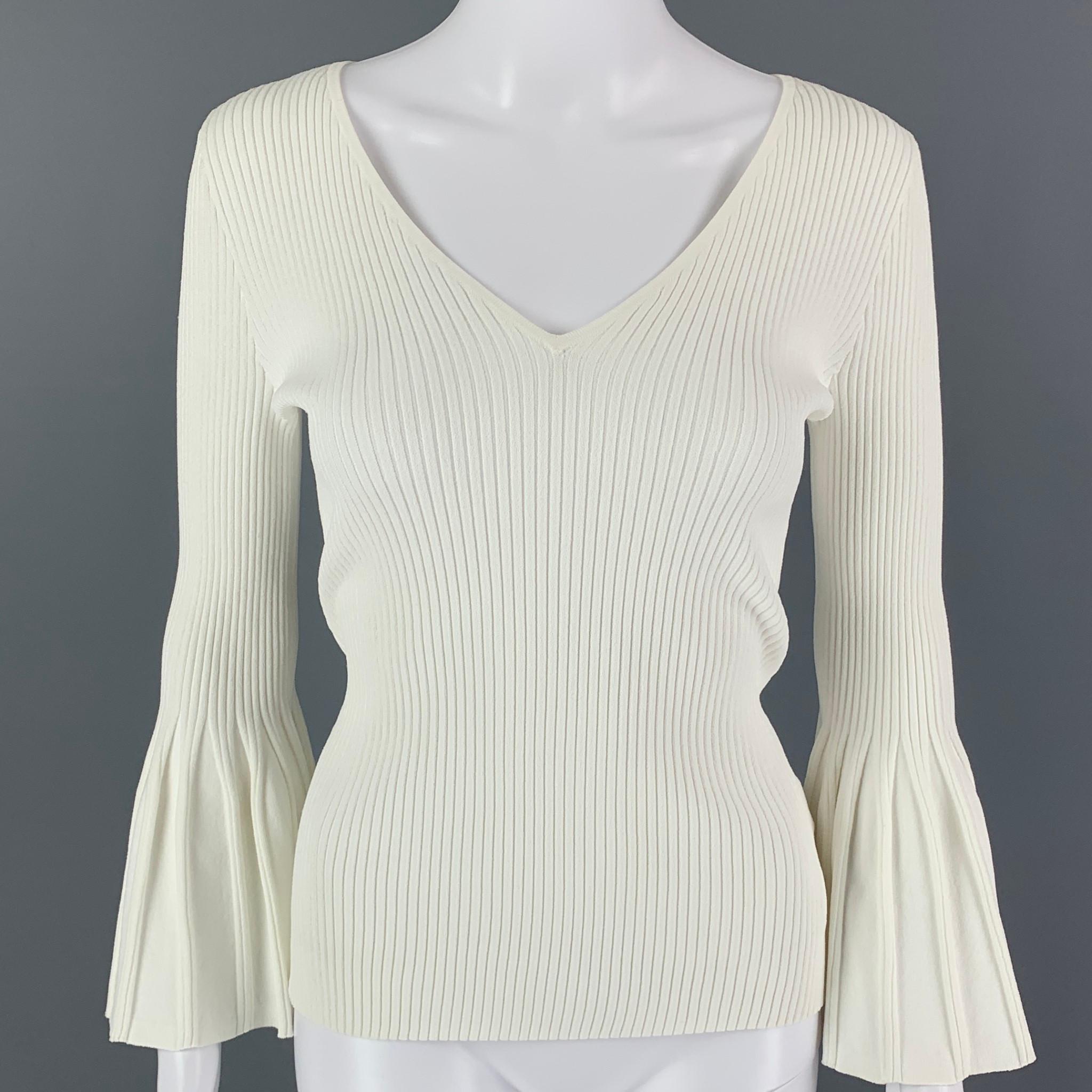 CAROLINA HERRERA top comes in a white stretch ribbed viscose / polyester featuring flared sleeves and a v-neck. 

Very Good Pre-Owned Condition.
Marked: M/M

Measurements:

Shoulder: 15 in.
Bust: 26 in.
Sleeve: 21 in.
Length: 23 in.

SKU: