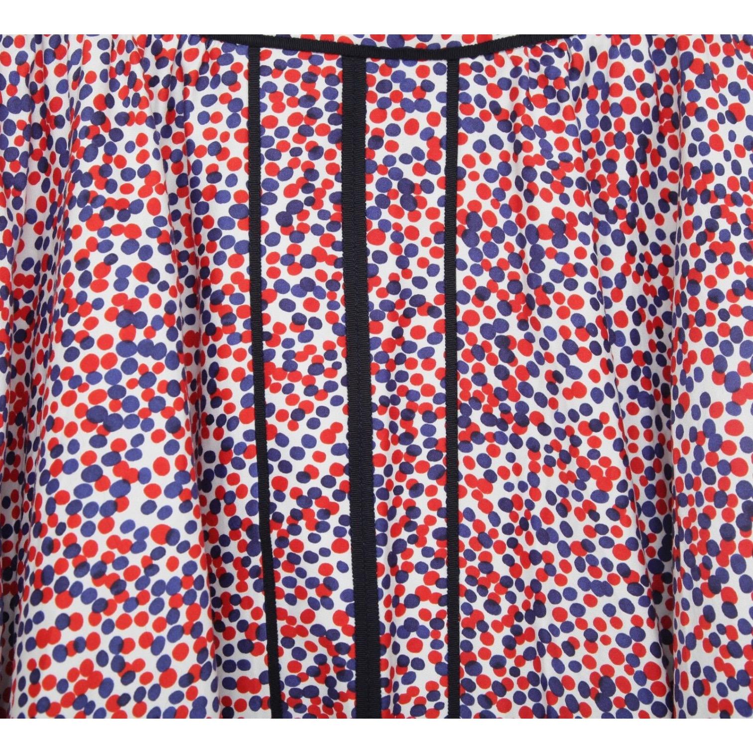 GUARANTEED AUTHENTIC CAROLINA HERRERA NEW YORK UMBRELLA SKIRT

Details:
- Umbrella style cotton blend skirt in a polka dot print.
- Colors are red, blue and white.
- Front split hem.
- Side covered zipper with double hook closure.
-
