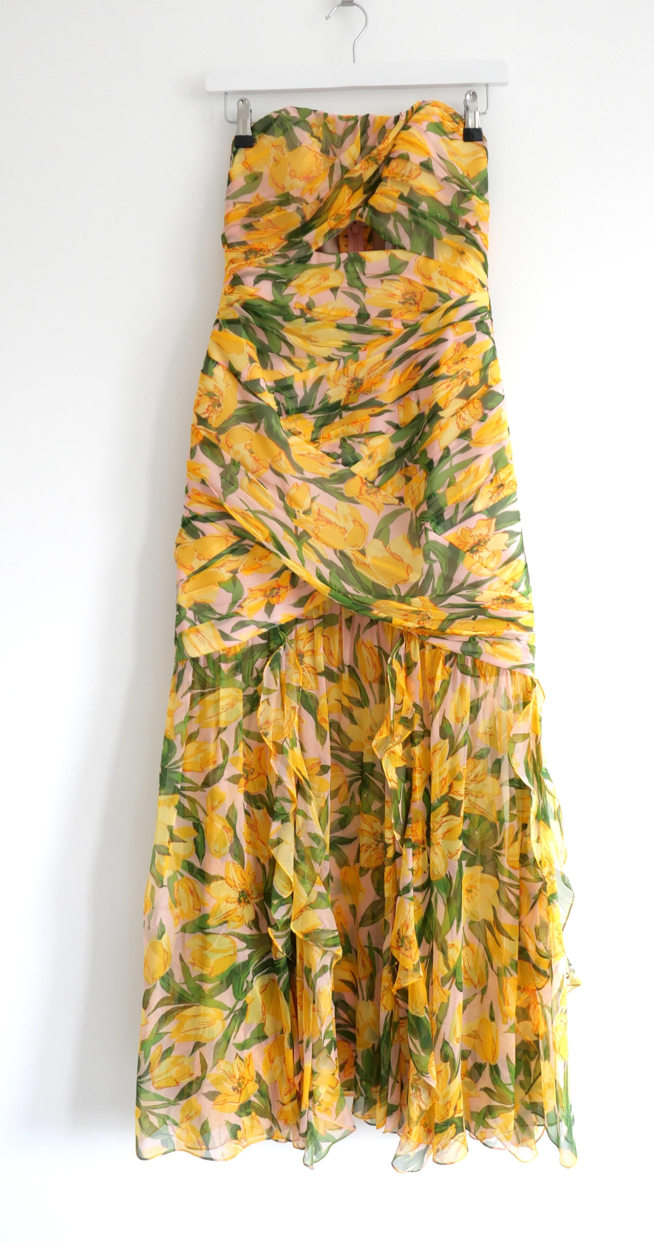Absolutely incredible, hyper feminine Carolina Herrera strapless gathered bustier floral print gown dress. Bought for $4750 and new with tags. Made from yellow and pink tulip printed silk chiffon with a chiffon lining and structural voile mid layer