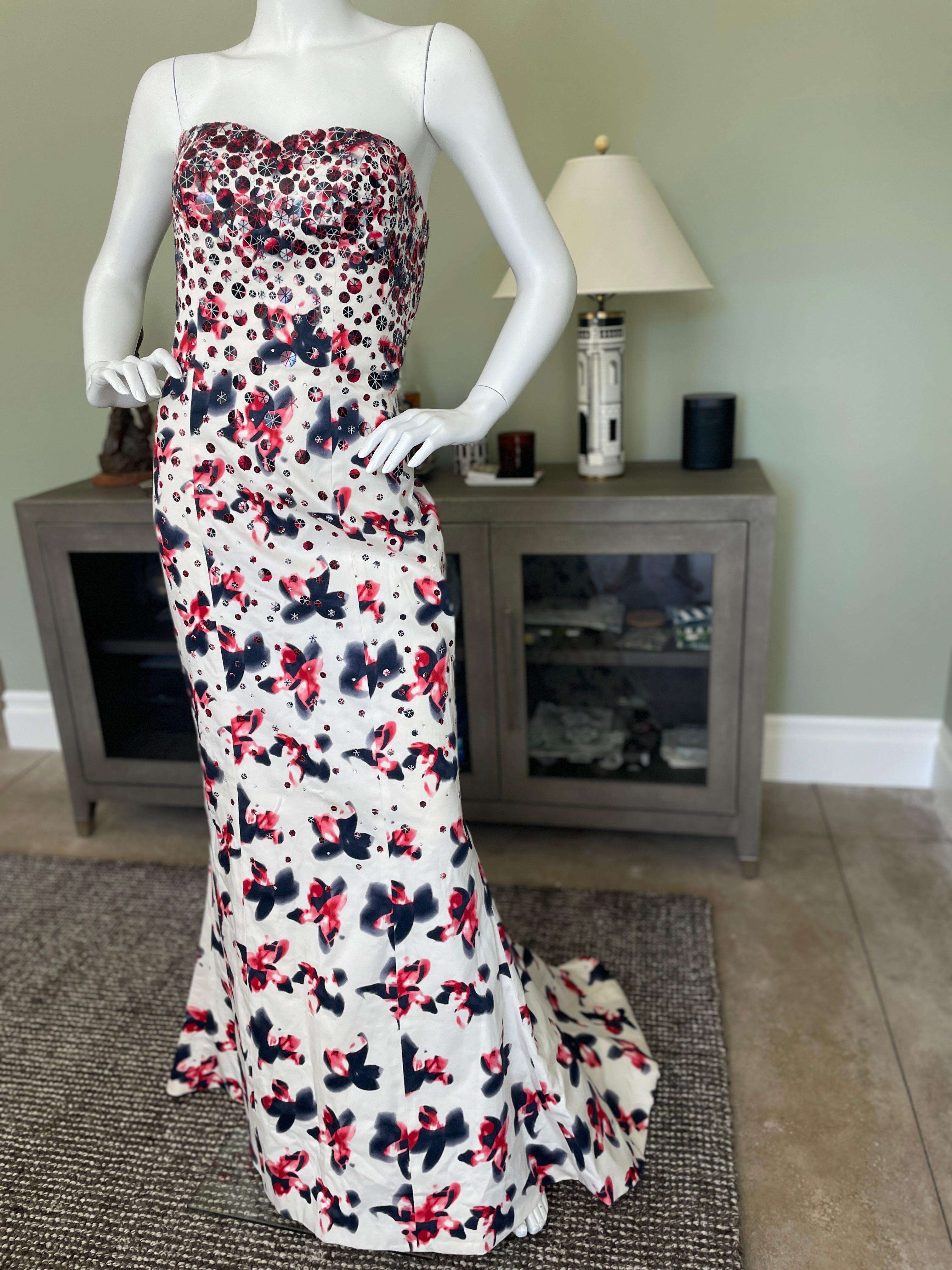 Carolina Herrera Vintage Strapless Floral Embellished Mermaid Dress with full train.
Feels like a fine cotton, it is quite lightweight, and has a full inner corset.
There is a wonderful full train
Size 4
  Bust 32