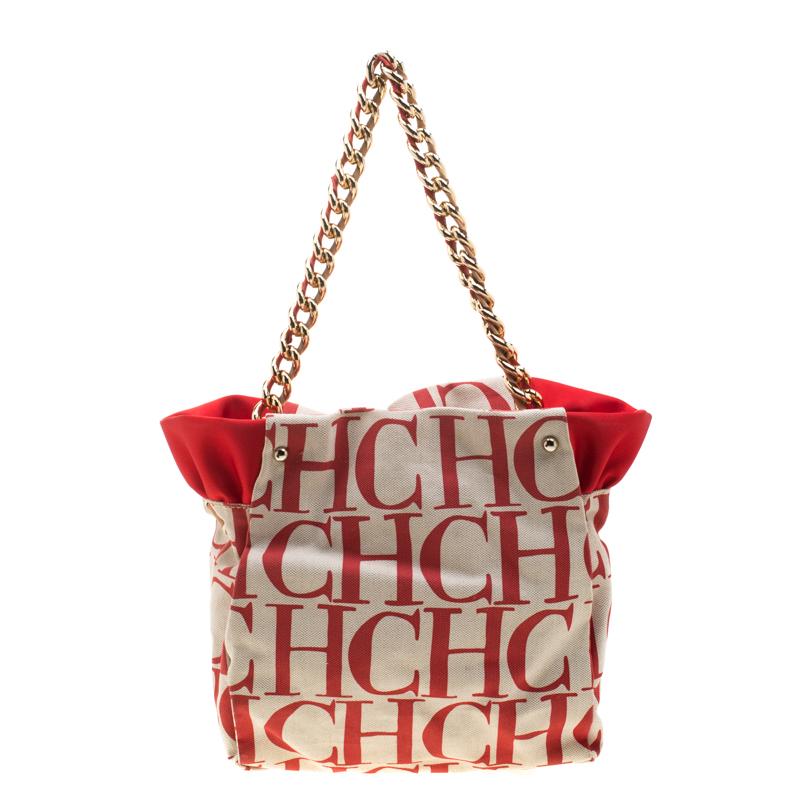 We bring you this carefully designed Carolina Herrera bag that is made with love and passion. Crafted from red and white canvas the bag can be held using the chain handle. The interior is spacious and will hold your necessities with ease.

Includes: