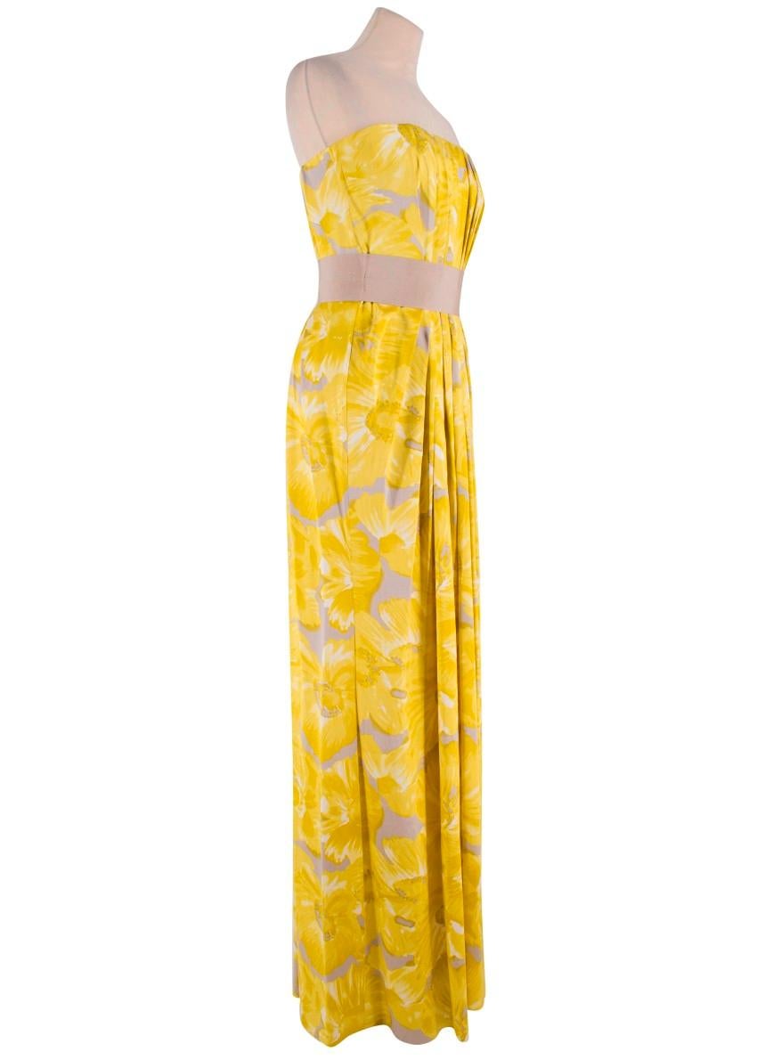 Carolina Herrera Yellow Floral Strapless Silk Gown

-Yellow/Grey/White floral pattern
-Strapless fit
-Thick tan belt with four hook and eye clasps for closure
-Pleated style to top
-Hidden zipper and hook and eye clasp for closure to the back