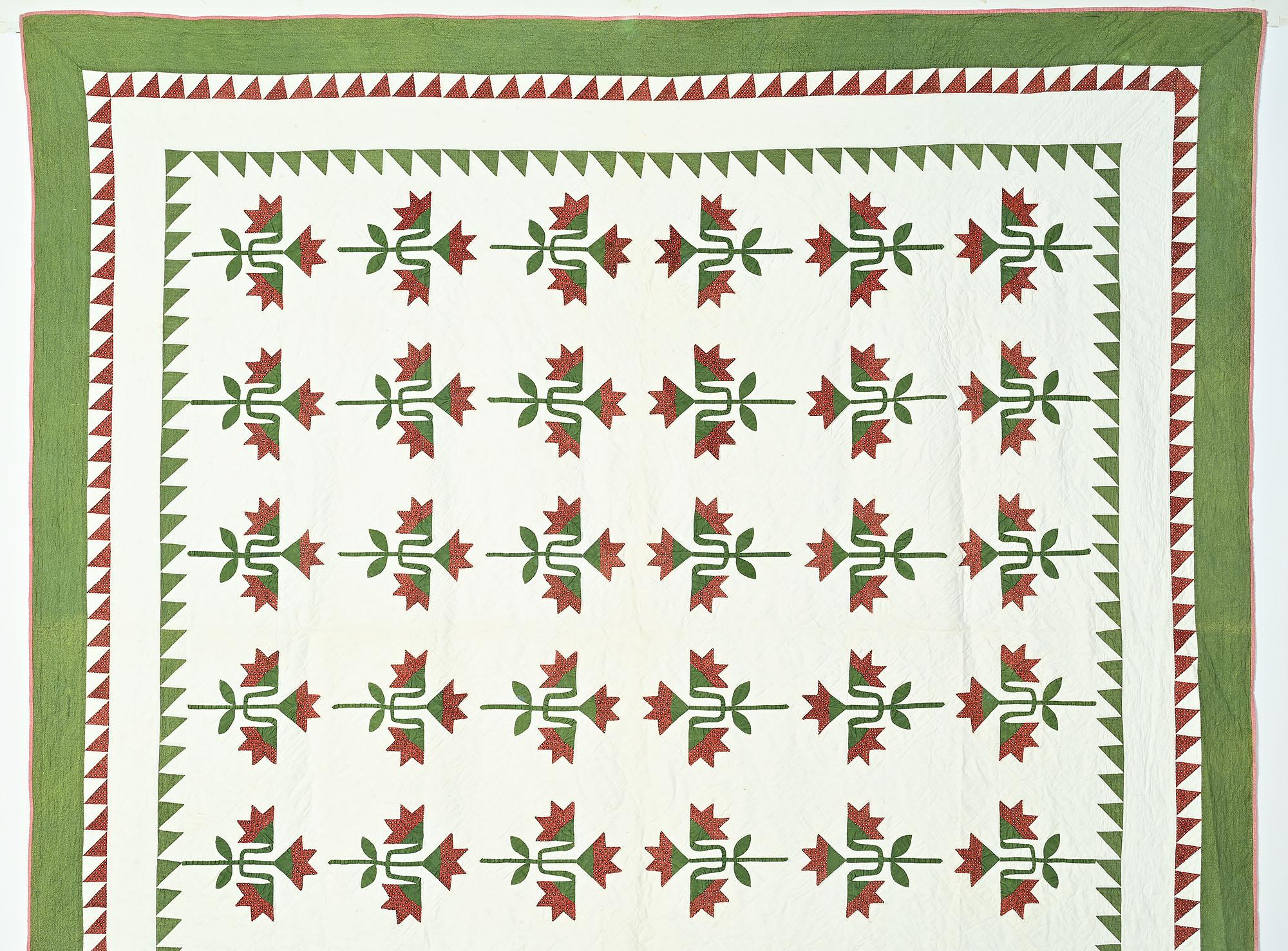 A well crafted version of the traditional Carolina Lily pattern. It is delicately pieced and appliqued with especially fine stems and leaves. It has a thin batting so although the quilting in the white blocks is very well done, it is not