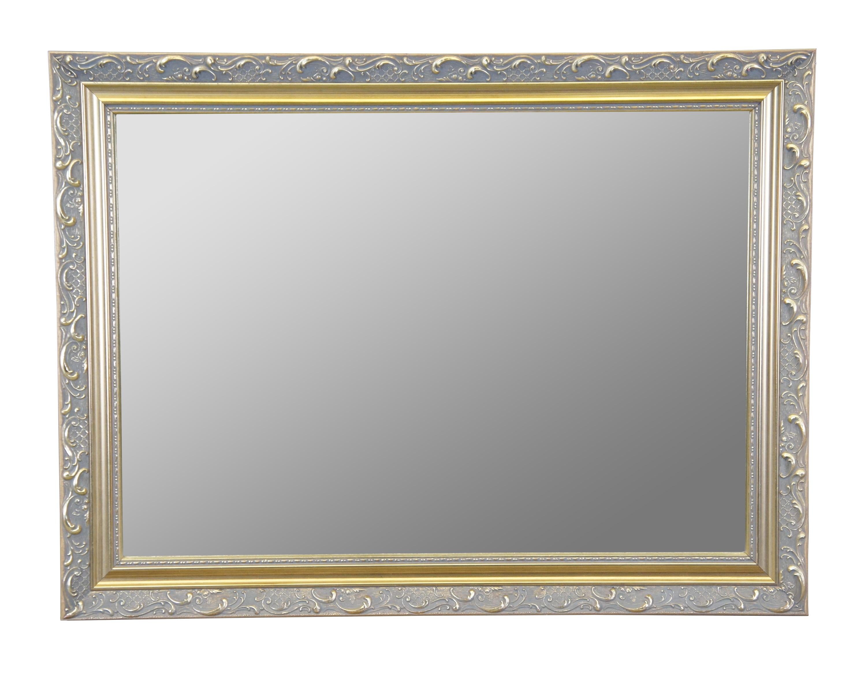 Carolina Mirror Company rectangular mirror with bevelled glass. Features a gold frame with 