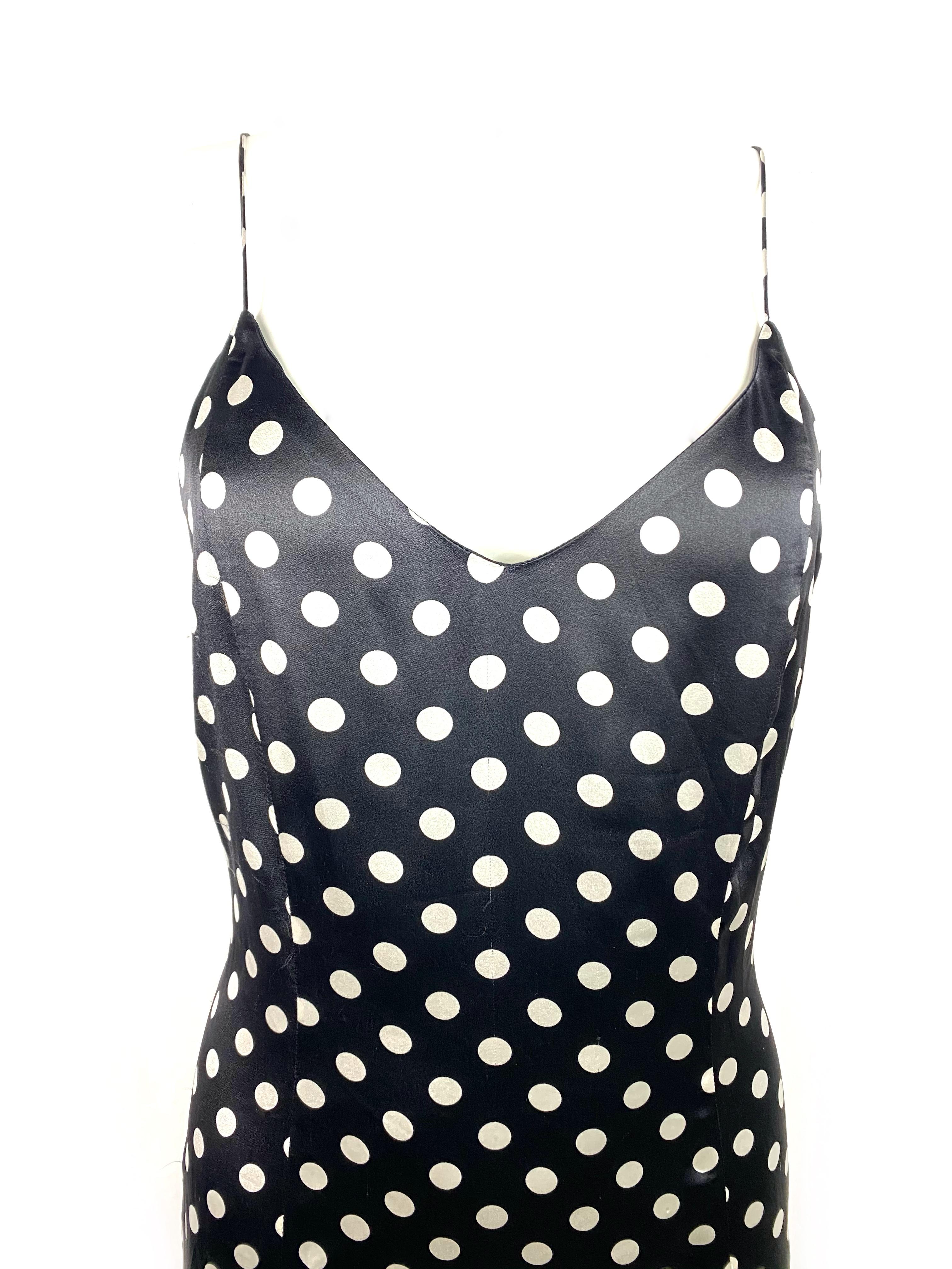 Product details:

The dress features black and white polka dot pattern, spaghetti straps, side zip and hook closure, mid length. 