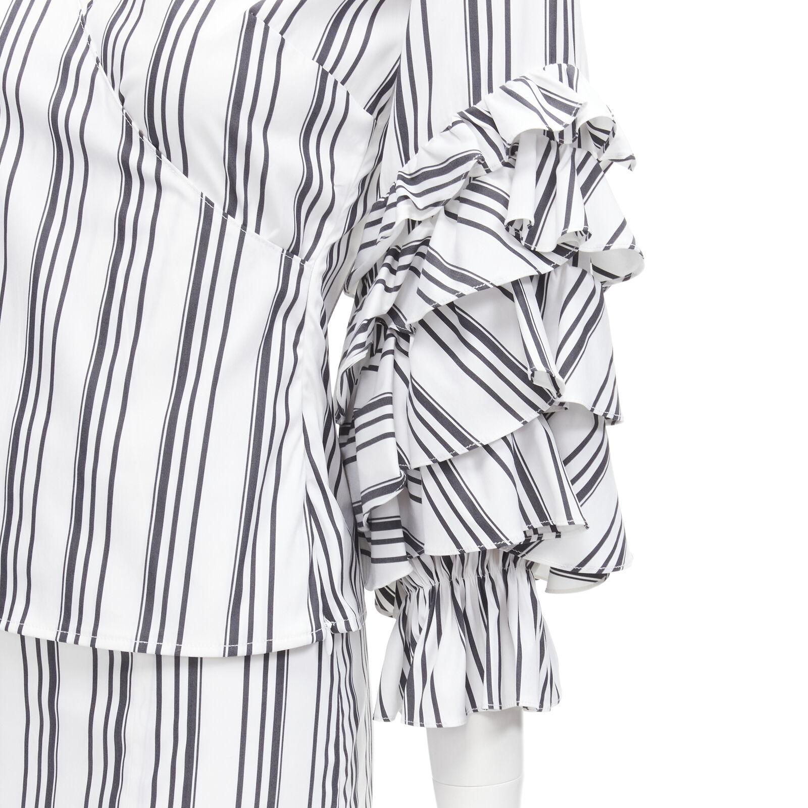 CAROLINE CONSTAS black white ruffled stripes wrap top high low skirt set XS
Reference: AAWC/A00425
Brand: Caroline Constas
Material: Cotton, Blend
Color: White, Black
Pattern: Striped
Closure: Zip
Extra Details: Side zip detsil.
Made in: United