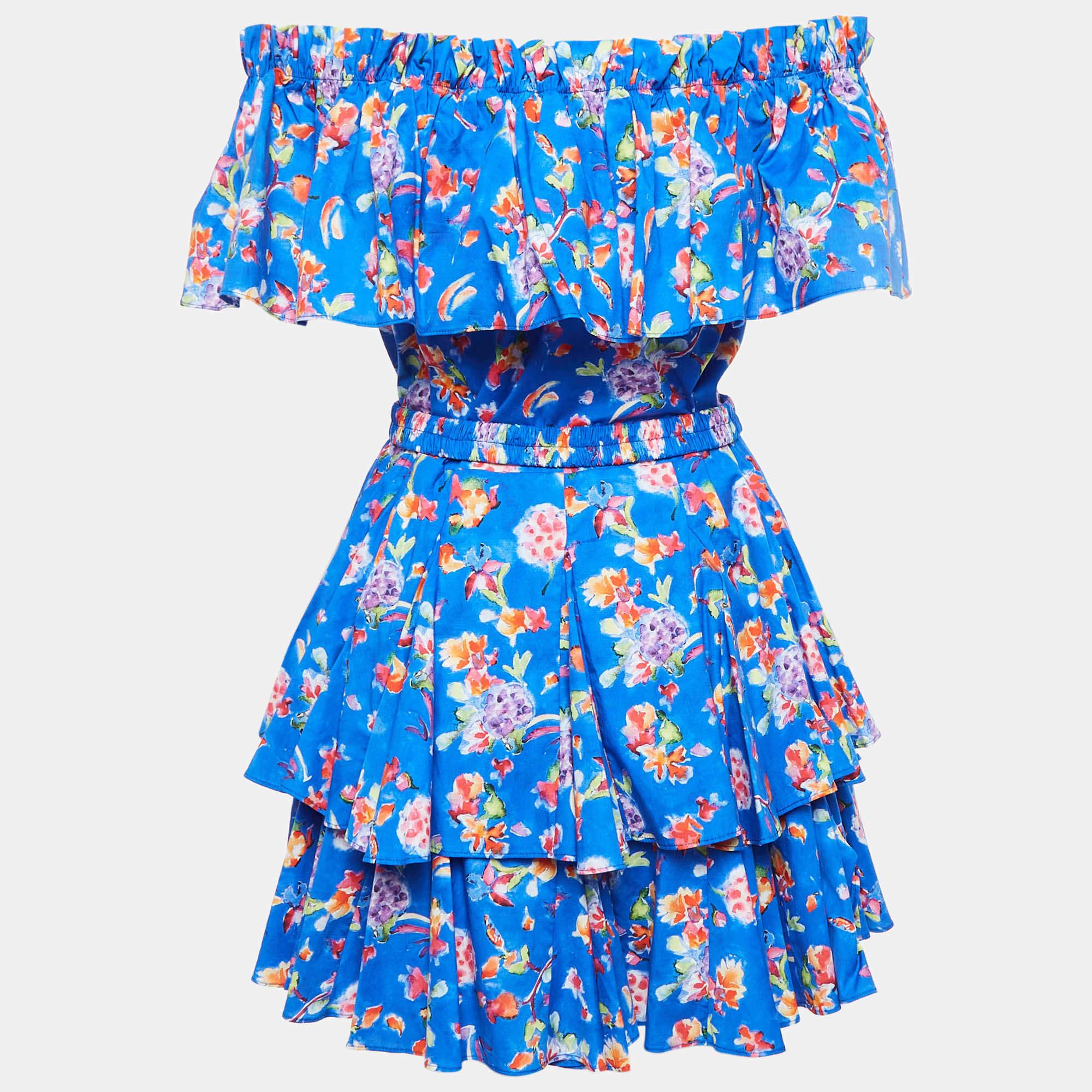 Elevate your style with the Caroline Constas dress. This playful piece features a vibrant blue print  crafted from a soft cotton blend for ultimate comfort. The ruffled detailing adds a touch of whimsy  while the mini length keeps it fresh and