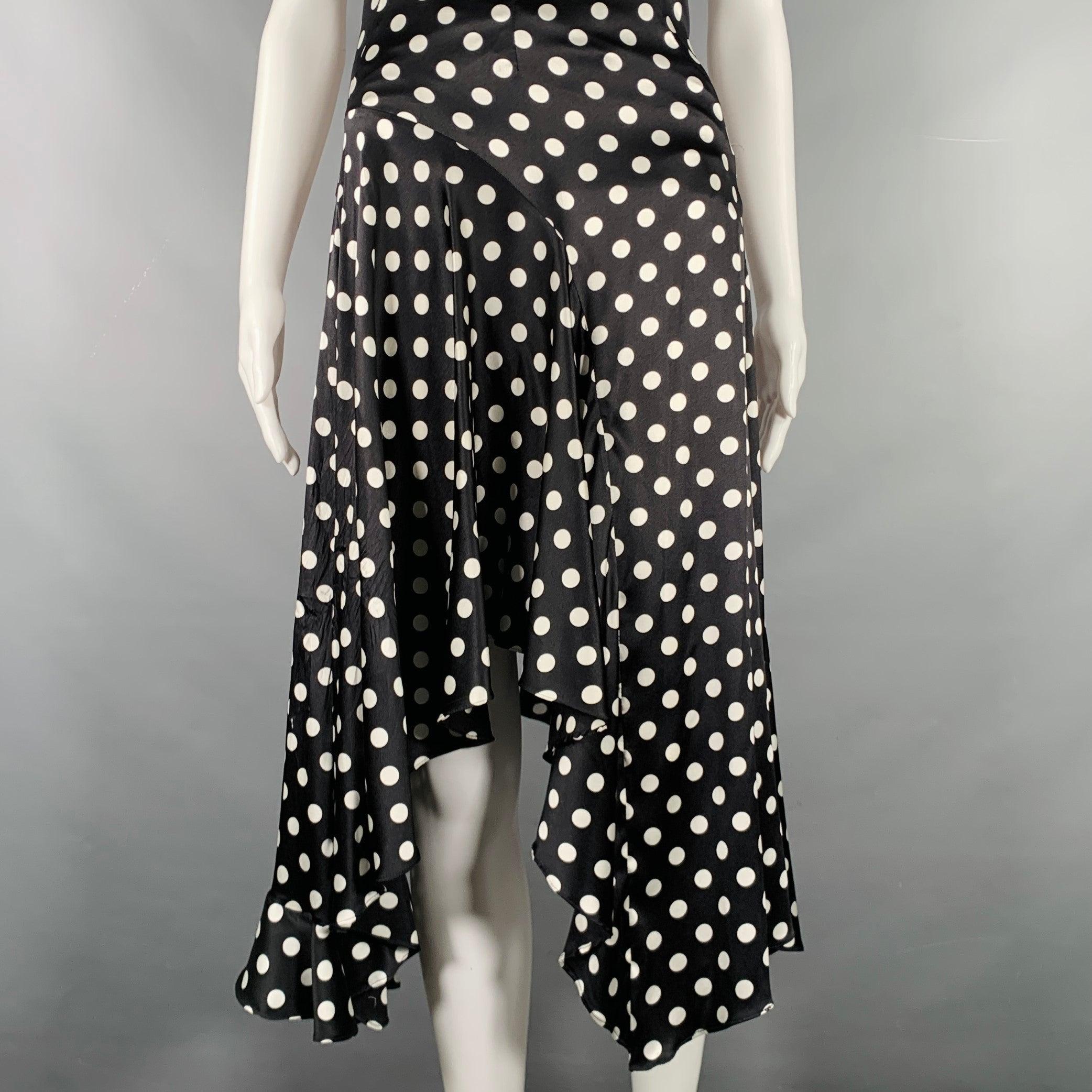 Vestido CAROLINE CONSTAS en tejido de mezcla de seda elástica en blanco y negro, con estilo asimétrico, estampado de lunares y cierre de cremallera lateral invisible. Fabricado en EE.UU. Excelente estado de conservación. 

Marcado:   XS 

Medidas: 
