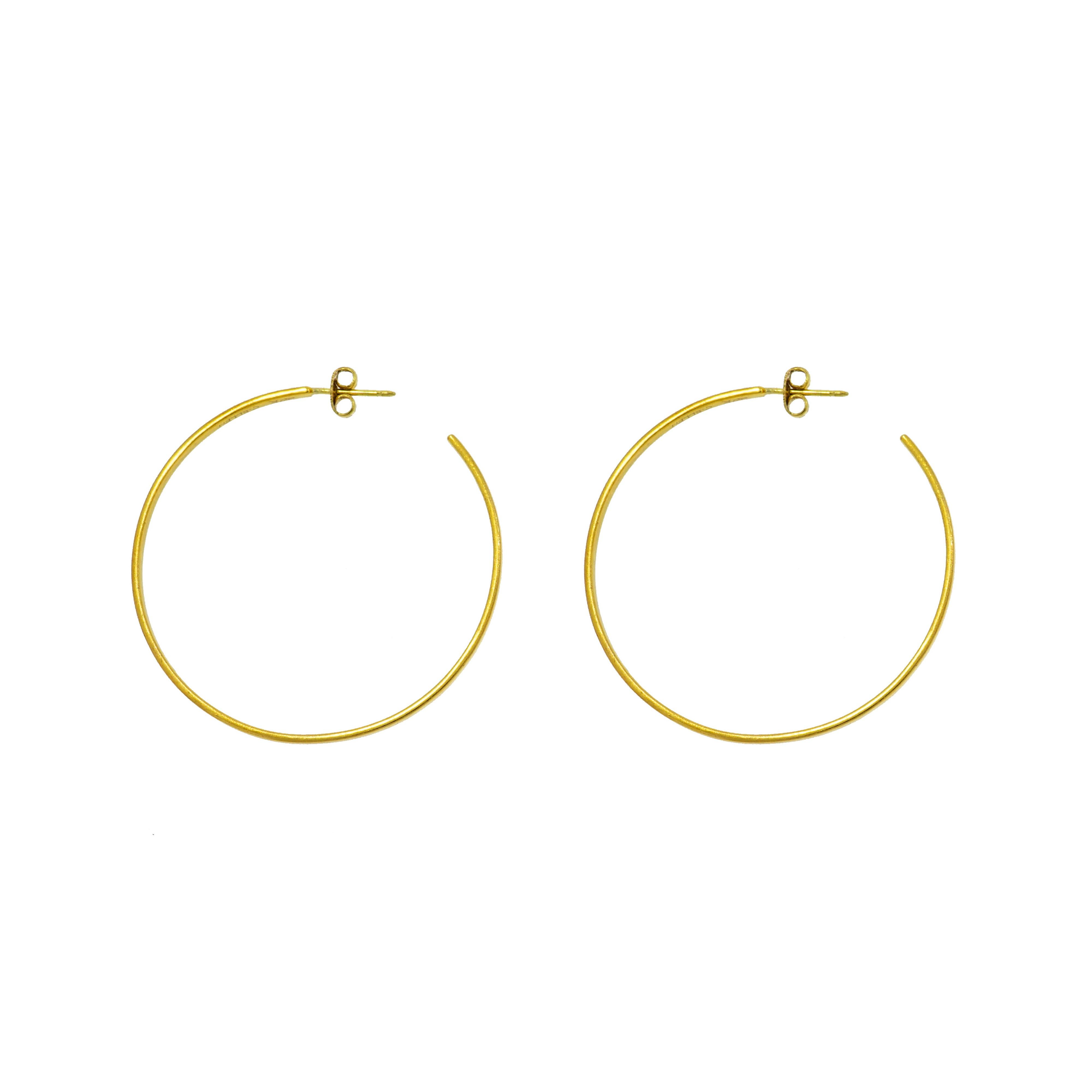 This Caroline Ellen's Hoop Earrings are inspired by pure geometrical shapes, and by the timeless simplicity of ancient jewelry. She strives to create jewelry that is modern, luxurious and yet timelessly classic. Her philosophy is to find beauty in