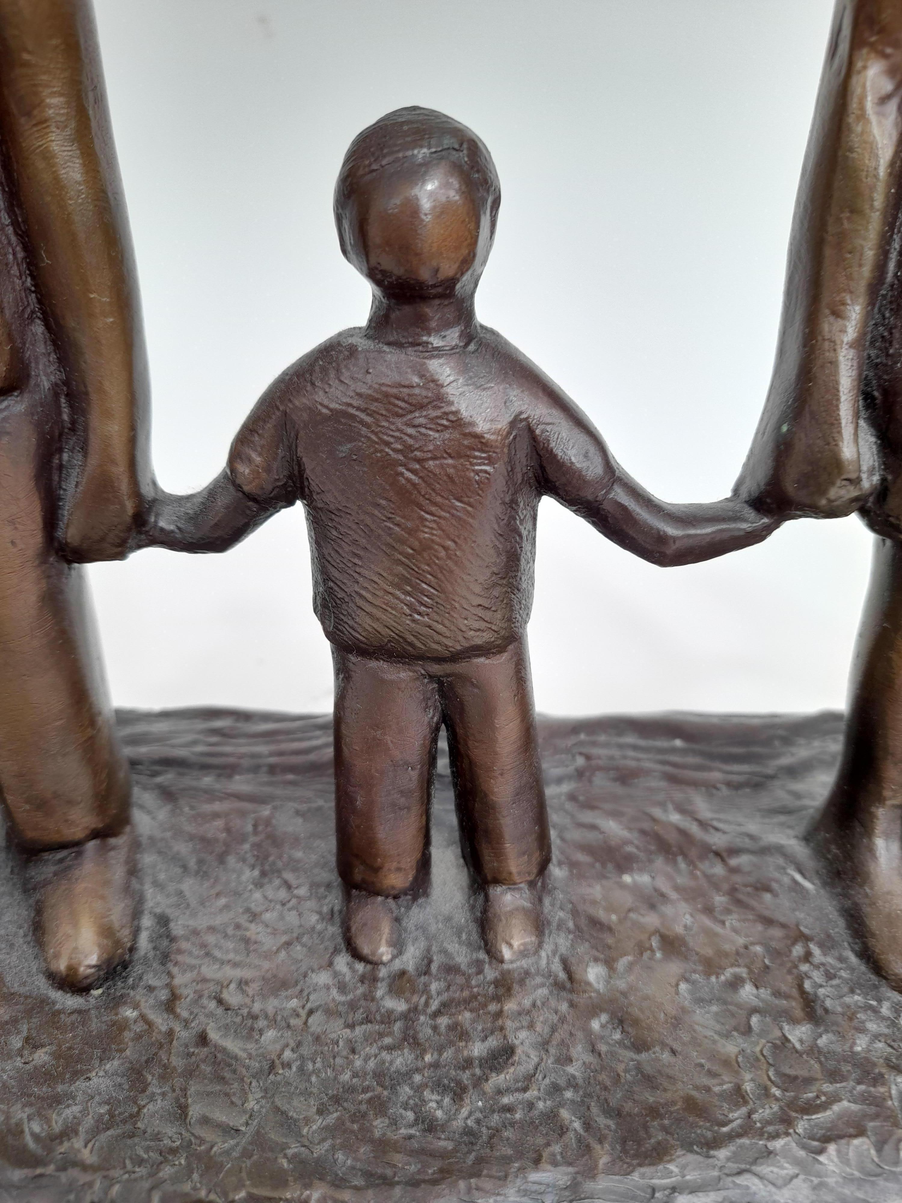 This sculpture is inspired by Caroline's own family and reflects the sizes relative to one another. She wanted to record the moment when her children were so much smaller than her and her husband, knowing that that moment in time would not last. 