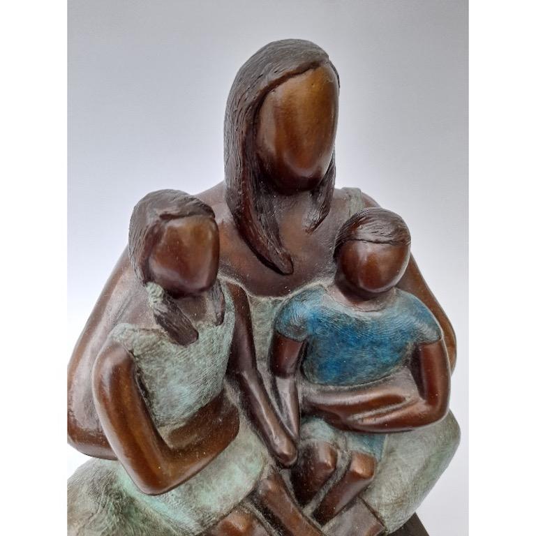 One of the first sculptures Caroline made after her  second child was born. Her children and her often used to sit in this position when they were small. They both used to want to sit on her lap at the same time, so sat on one knee each.

Caroline