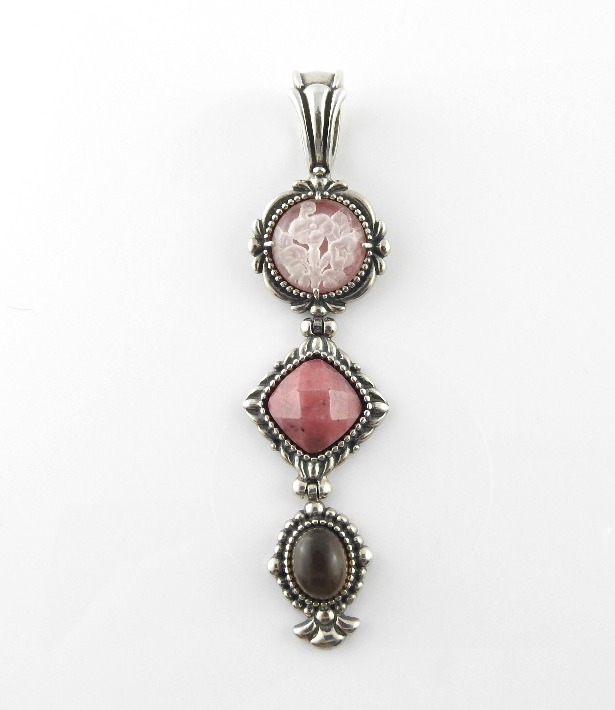 Carolyn Pollack Sterling Silver Carved Pink Quartz and Rhodonite Enhancer

3 stone Sterling Silver Necklace Pendant from Carolyn Pollack Collection. Top stone is cut with a flower design, followed by Pink Rhodonite, with a quartz stone on the