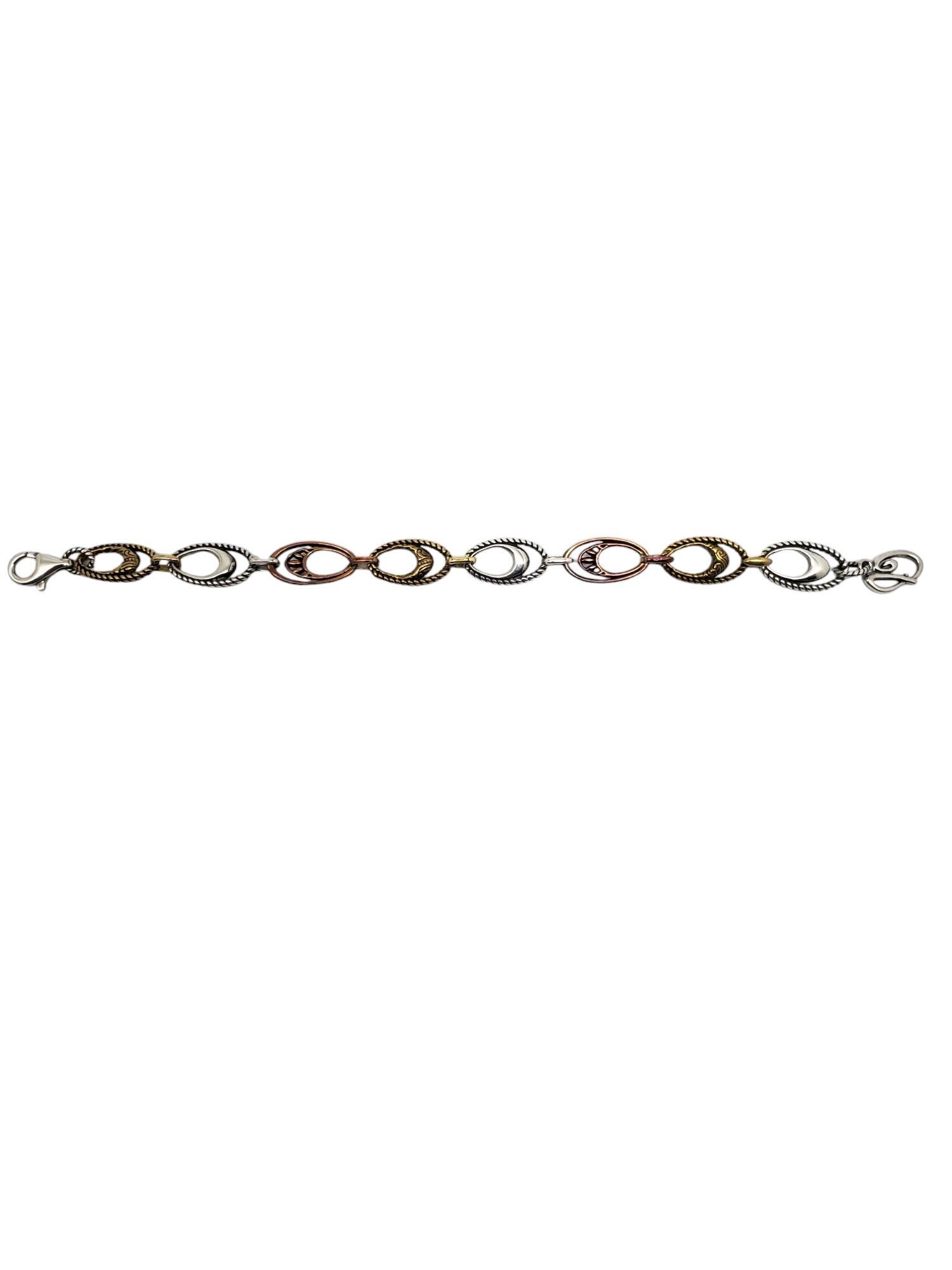 Carolyn Pollack Sterling Silver Copper Brass Link Bracelet-

This lovely bracelet features a series of smooth & textured oval shaped sterling silver copper & brass links with a lobster clasp by Carolyn Pollack.

Size: 6 3/4