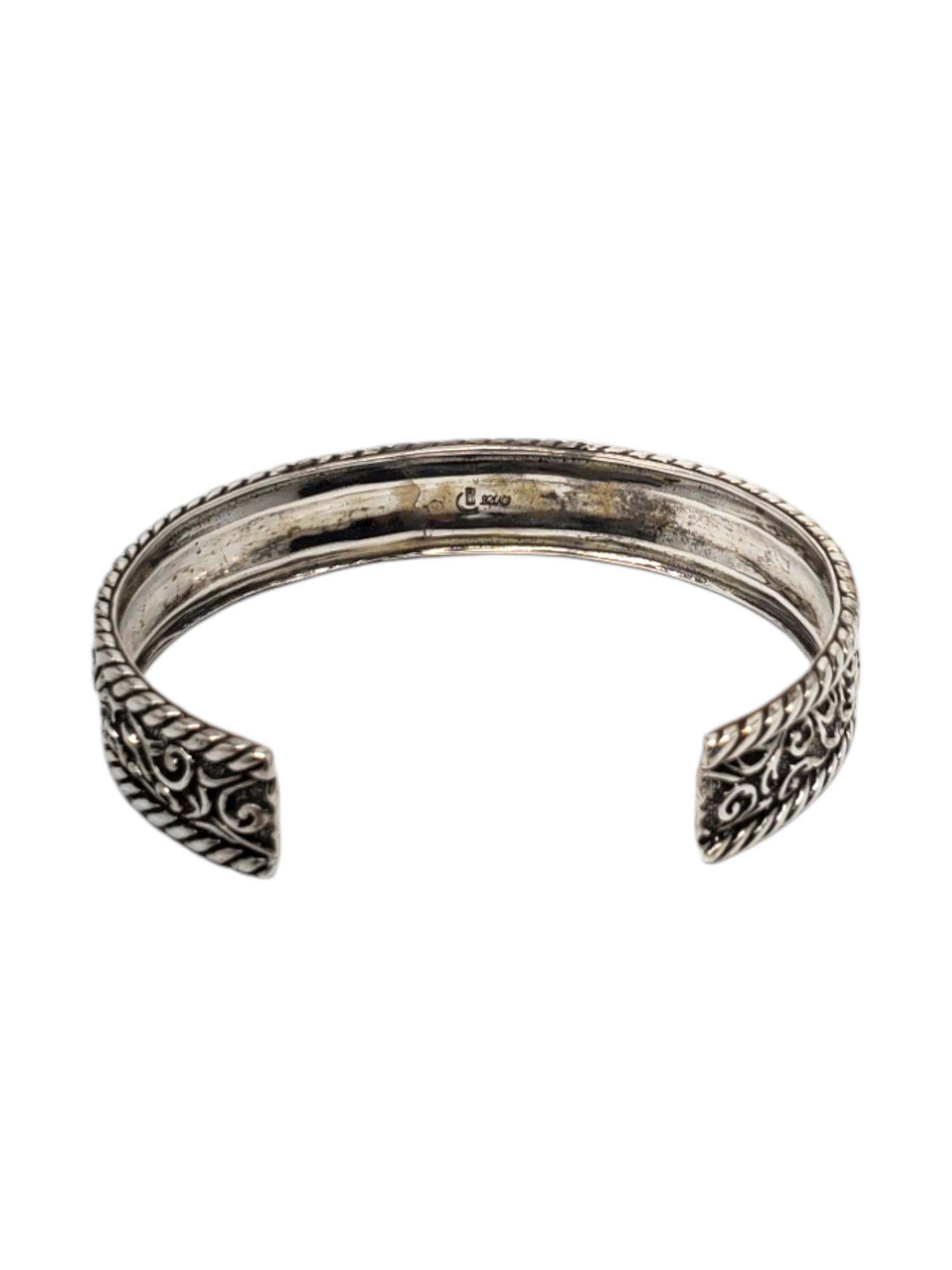 Carolyn Pollack Sterling Silver Diamond Cut Cuff Bracelet 

This vintage diamond cut cuff bracelet by Carolyn Pollack features a rope and scroll design set in sterling silver.

Size: 6 3/4