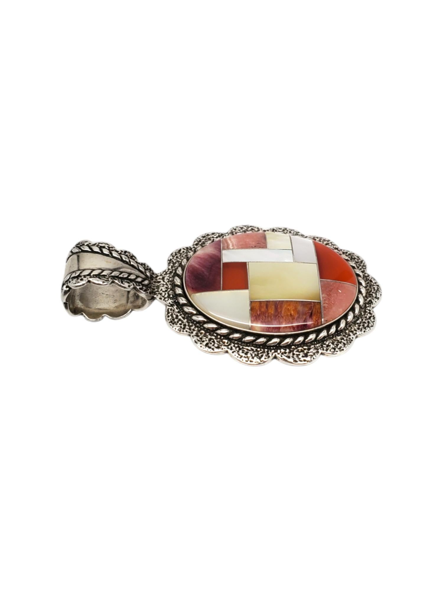 Carolyn Pollack Sterling Silver Multi-Stone Inlay Pendant -

This lovely multi-stone inlay pendant features purple spiny oyster, carnelian, mother of pearl & pink rhodocrosite and is set in sterling silver by Carolyn Pollack.

Size: 55.34 mm x