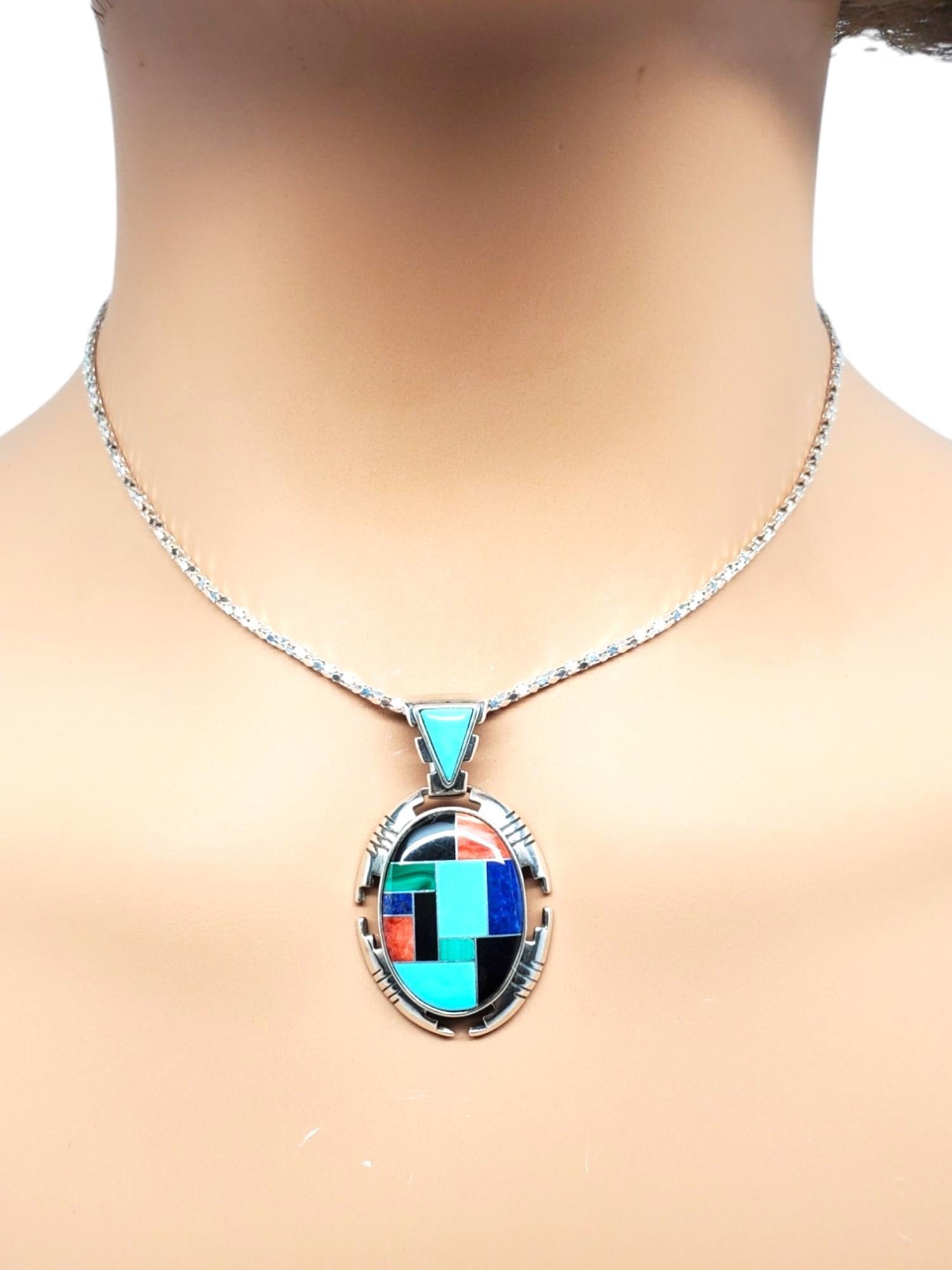 Carolyn Pollack Sterling Silver Multicolored Inlaid Gemstone Pendant- 

This stunning pendant by Carolyn Pollack is set in classic sterling silver with multicolored inlaid gemstones.

Size: 1.6 in. x 0.9 in.

Hallmark: 925 CJ.

Weight: 5.2 dwt./ 8.1